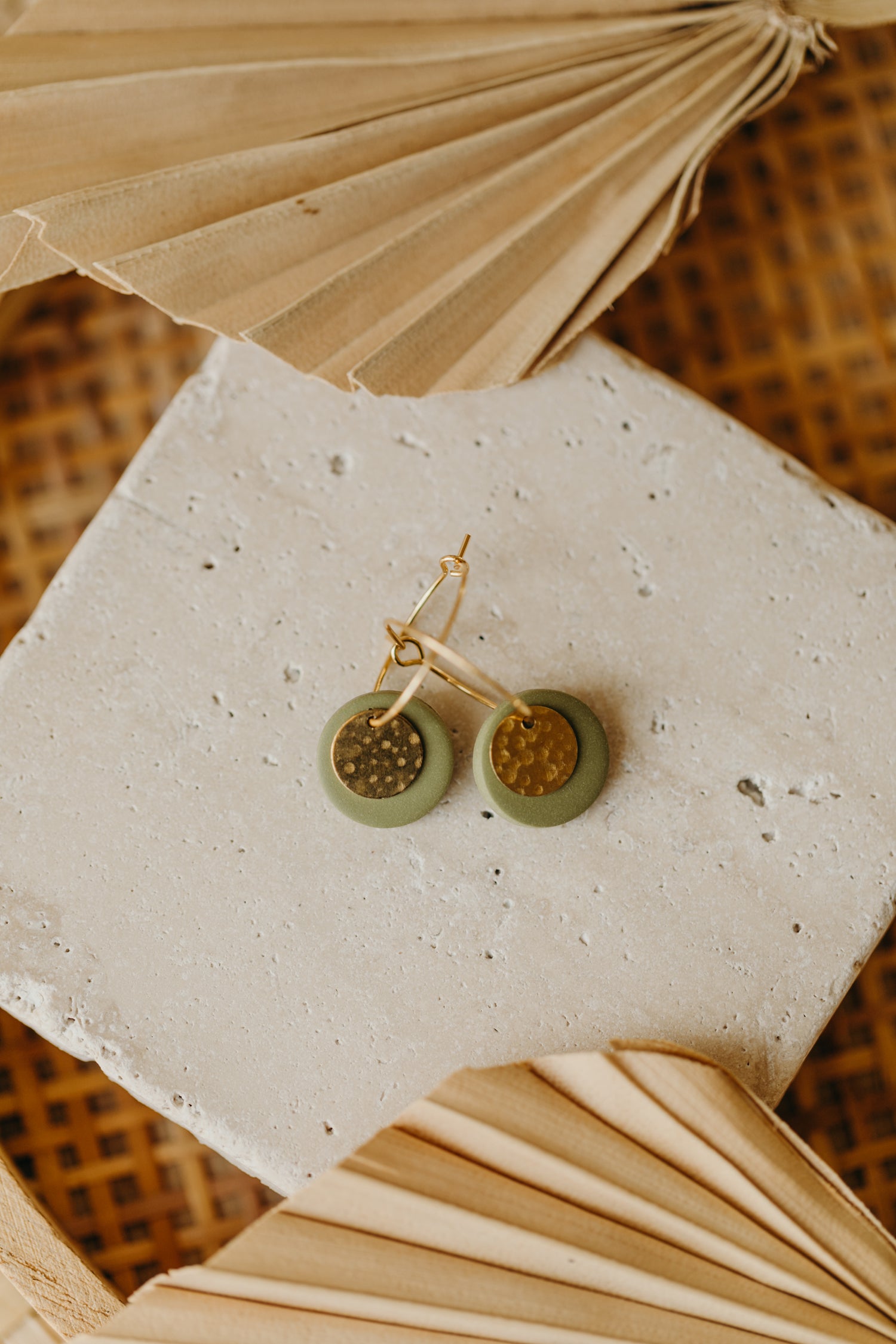 Hoop earrings with round polymer clay pendant and leaf