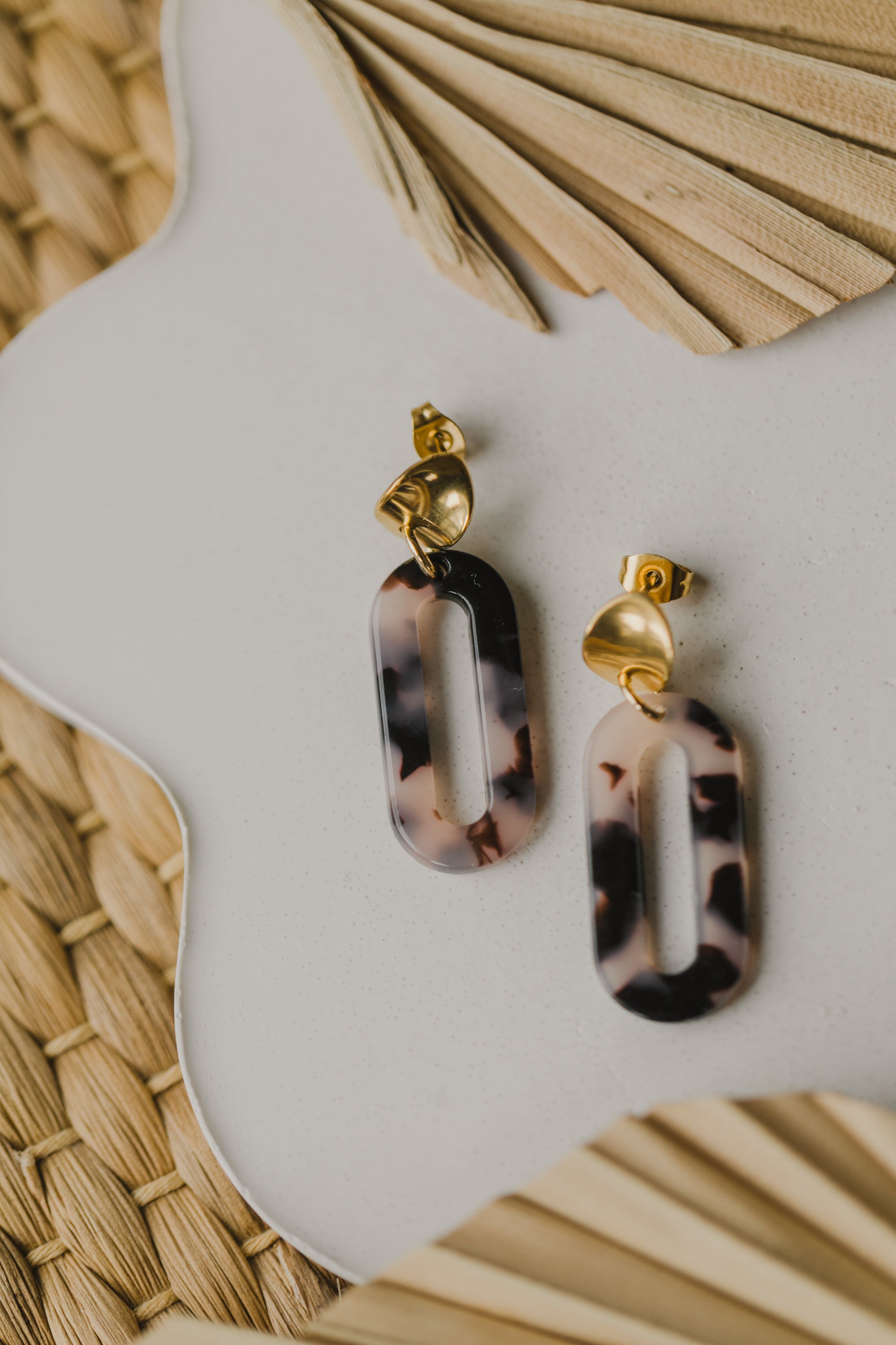 golden earrings with acrylic in white, petrol and brown