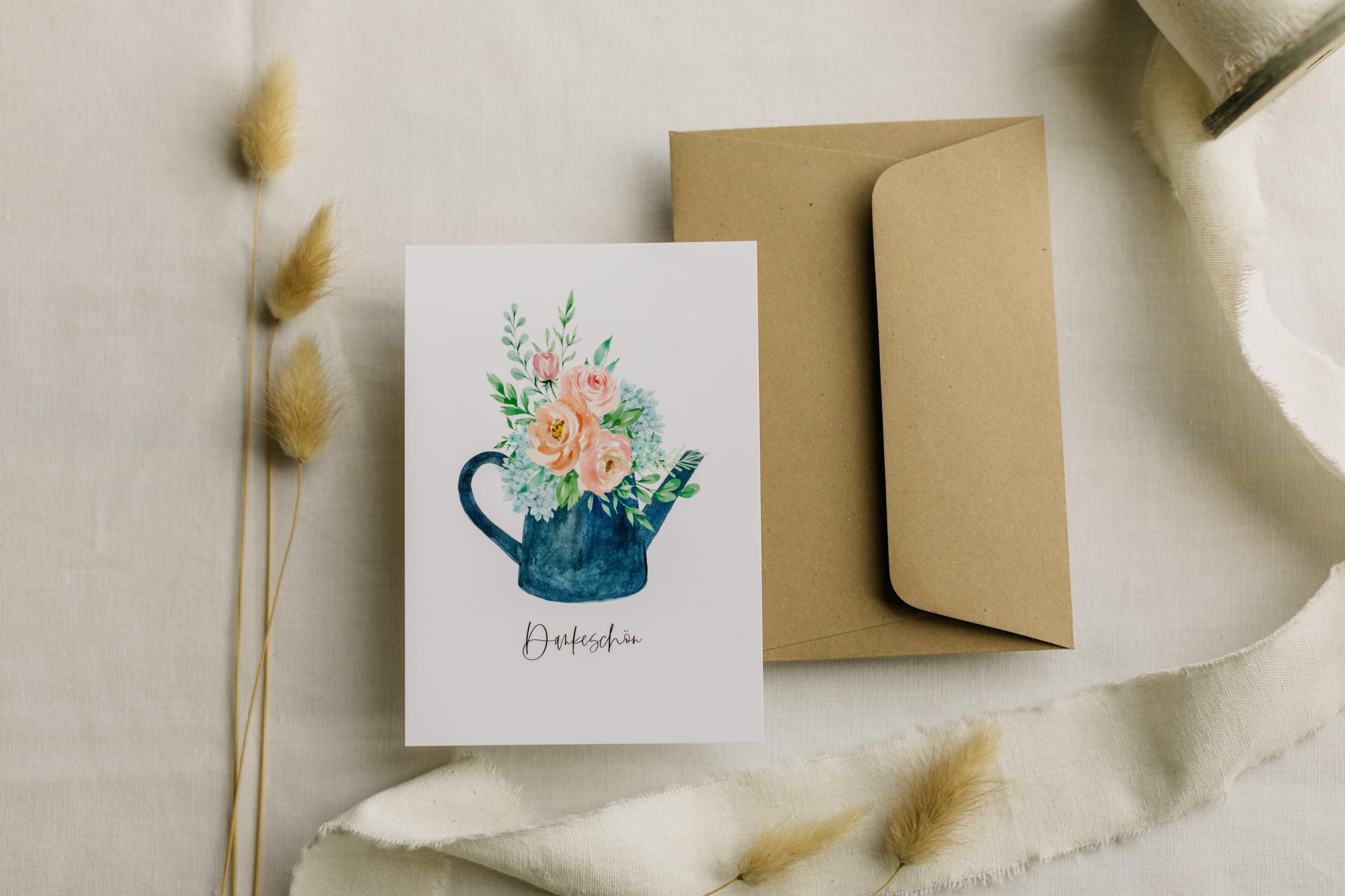 Postcard blue watering can with the print "Thank you"