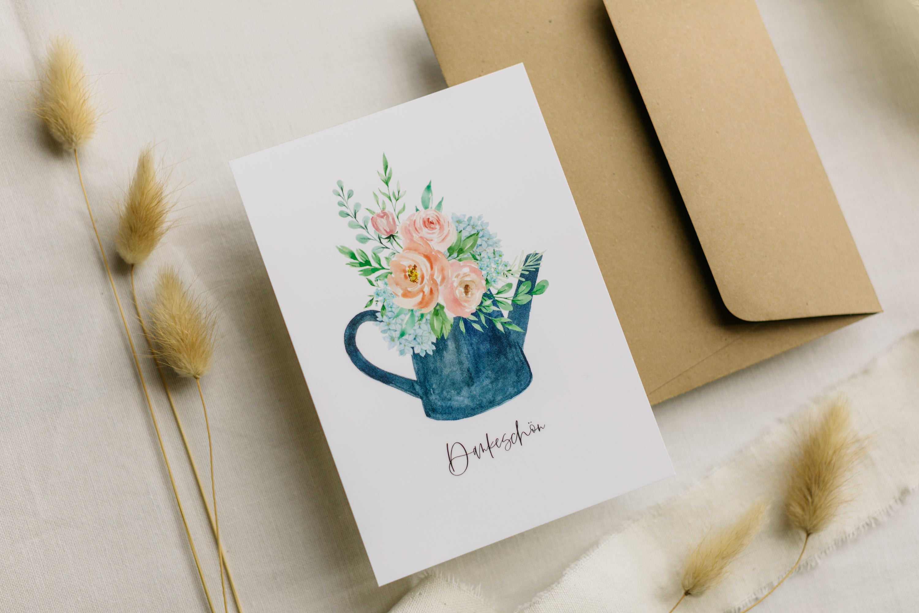 Postcard blue watering can with the print "Thank you"