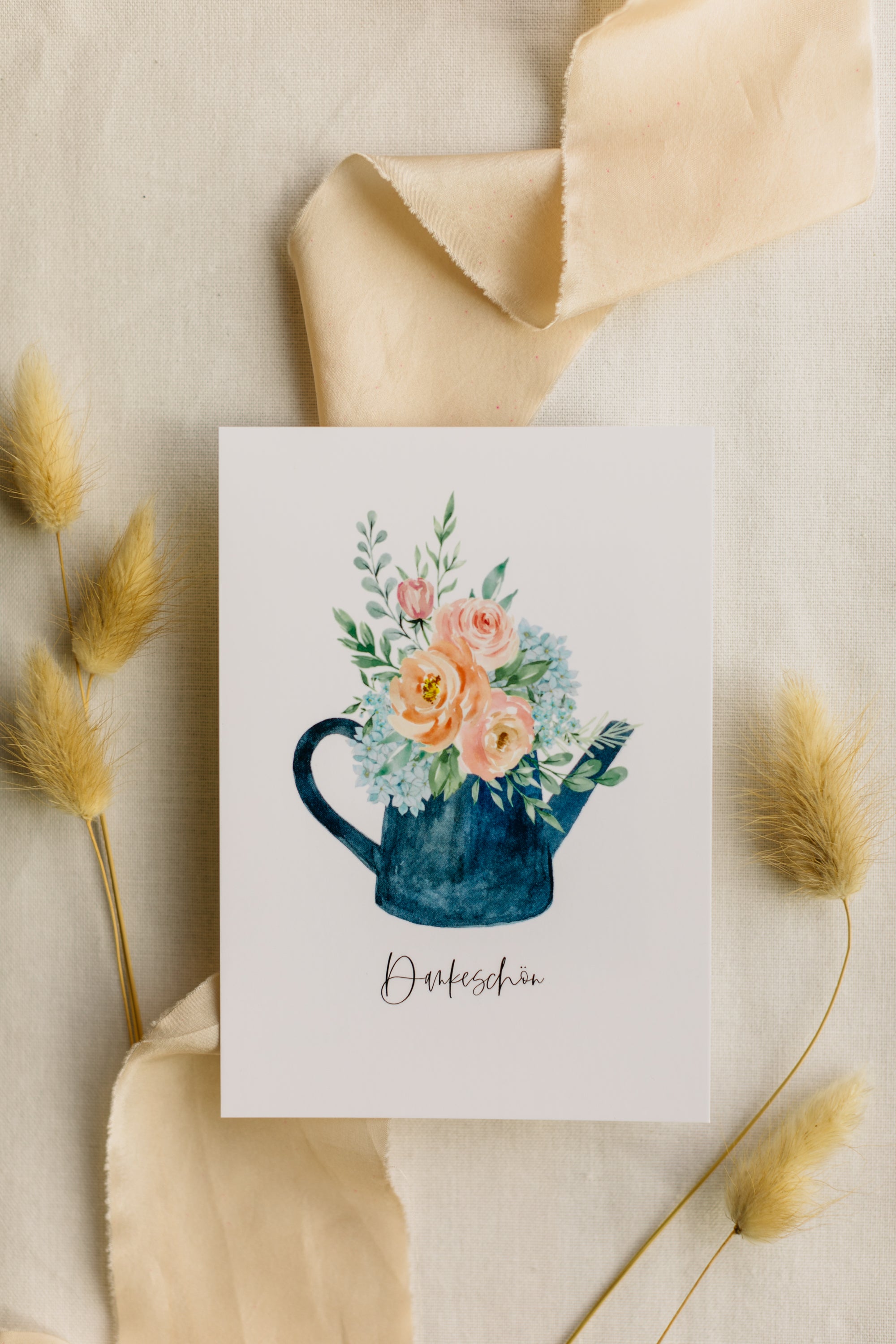 Postcard blue watering can with the print "Thank you"
