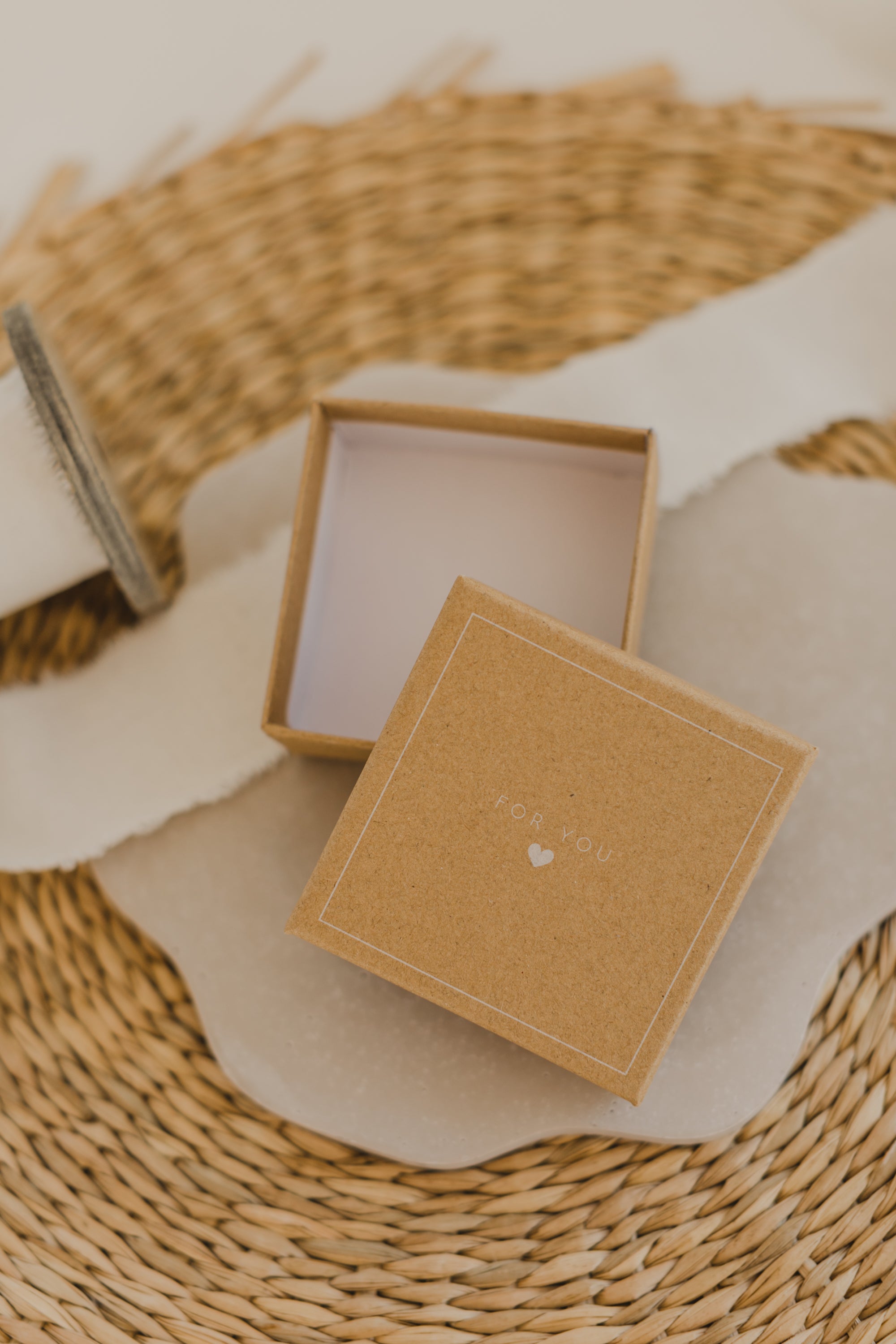 Gift box kraft paper with print "For You" and small white heart
