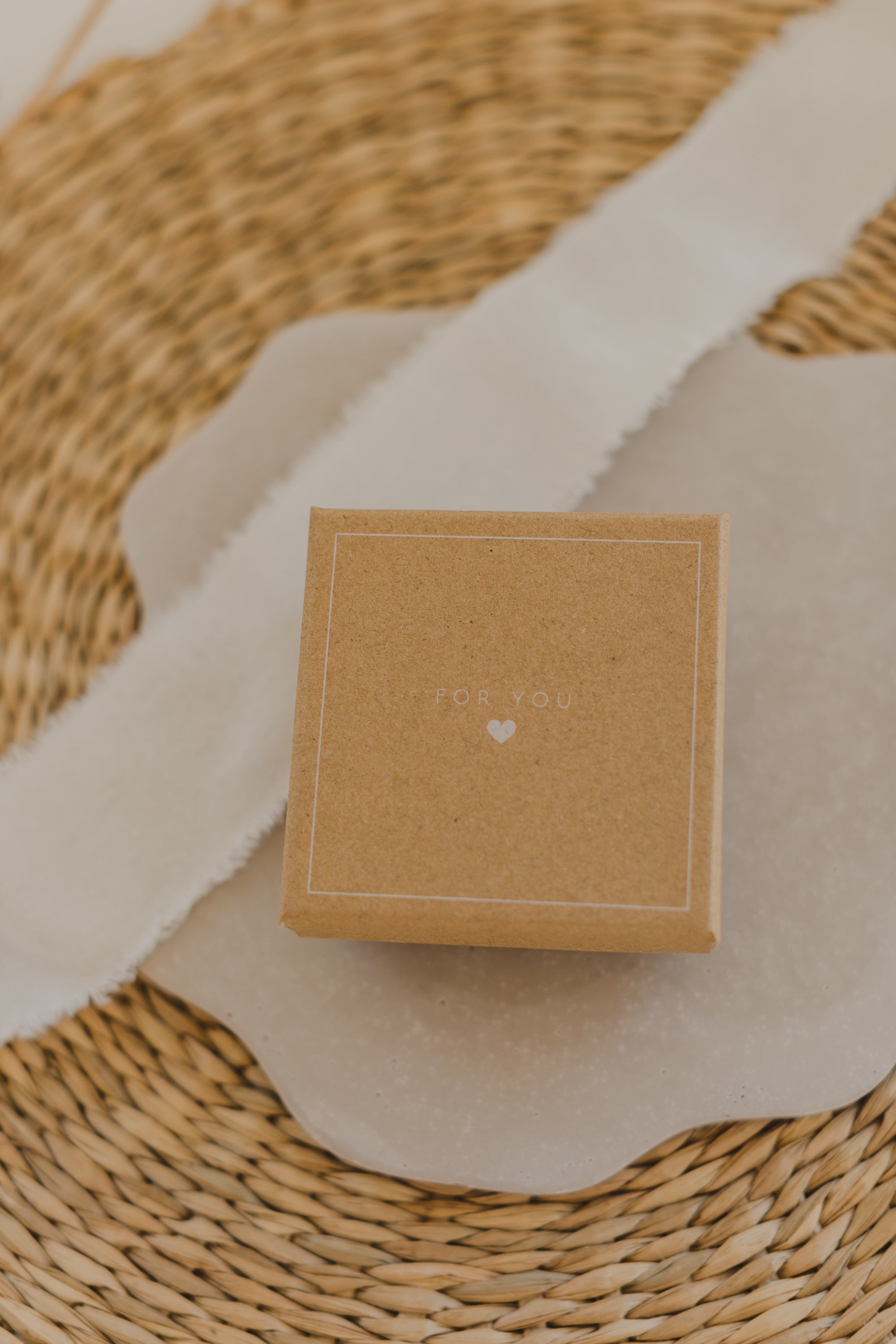 Gift box kraft paper with print "For You" and small white heart