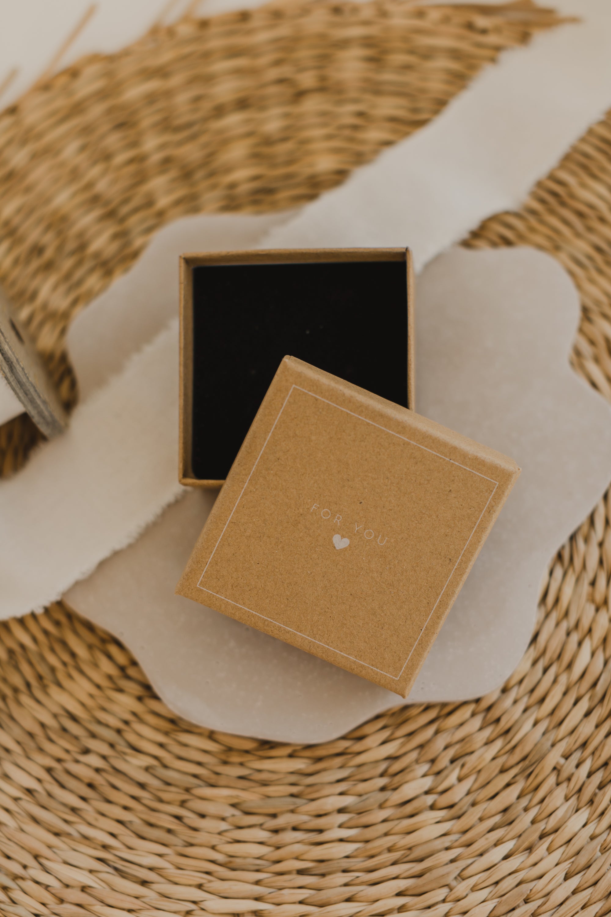 Gift box kraft paper with print "For You" and small white heart