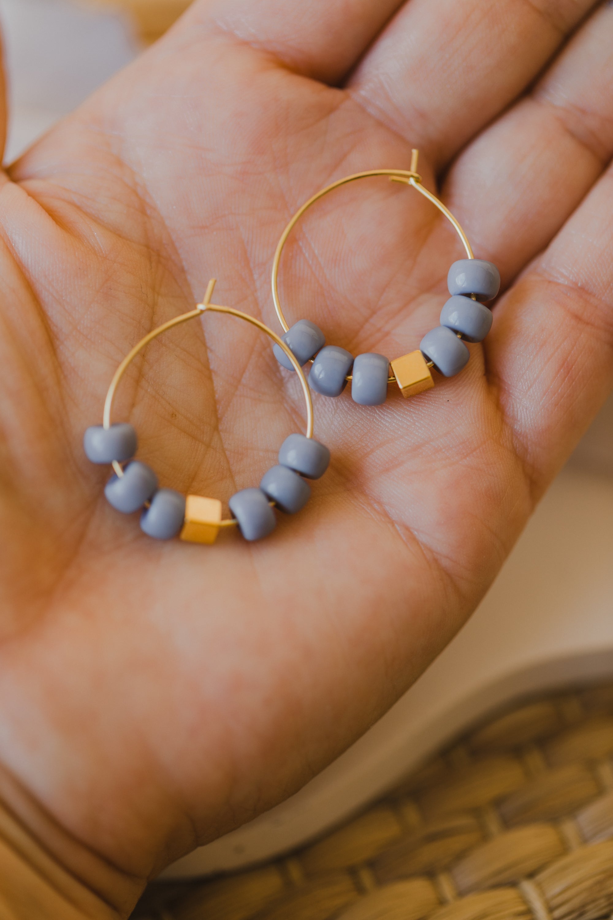 filigree creole made of titanium with blue ceramic beads