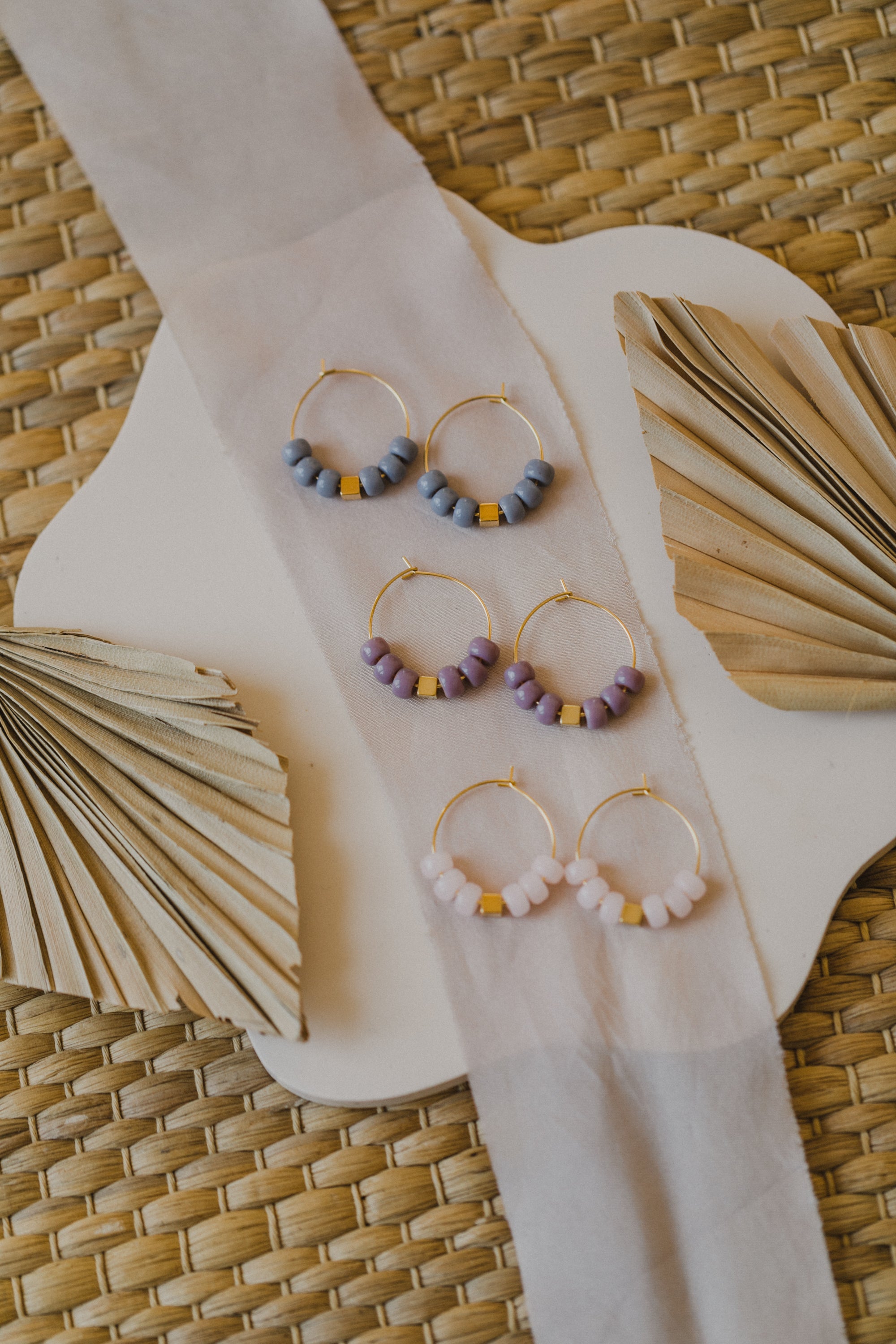 filigree creole made of titanium with pink ceramic beads