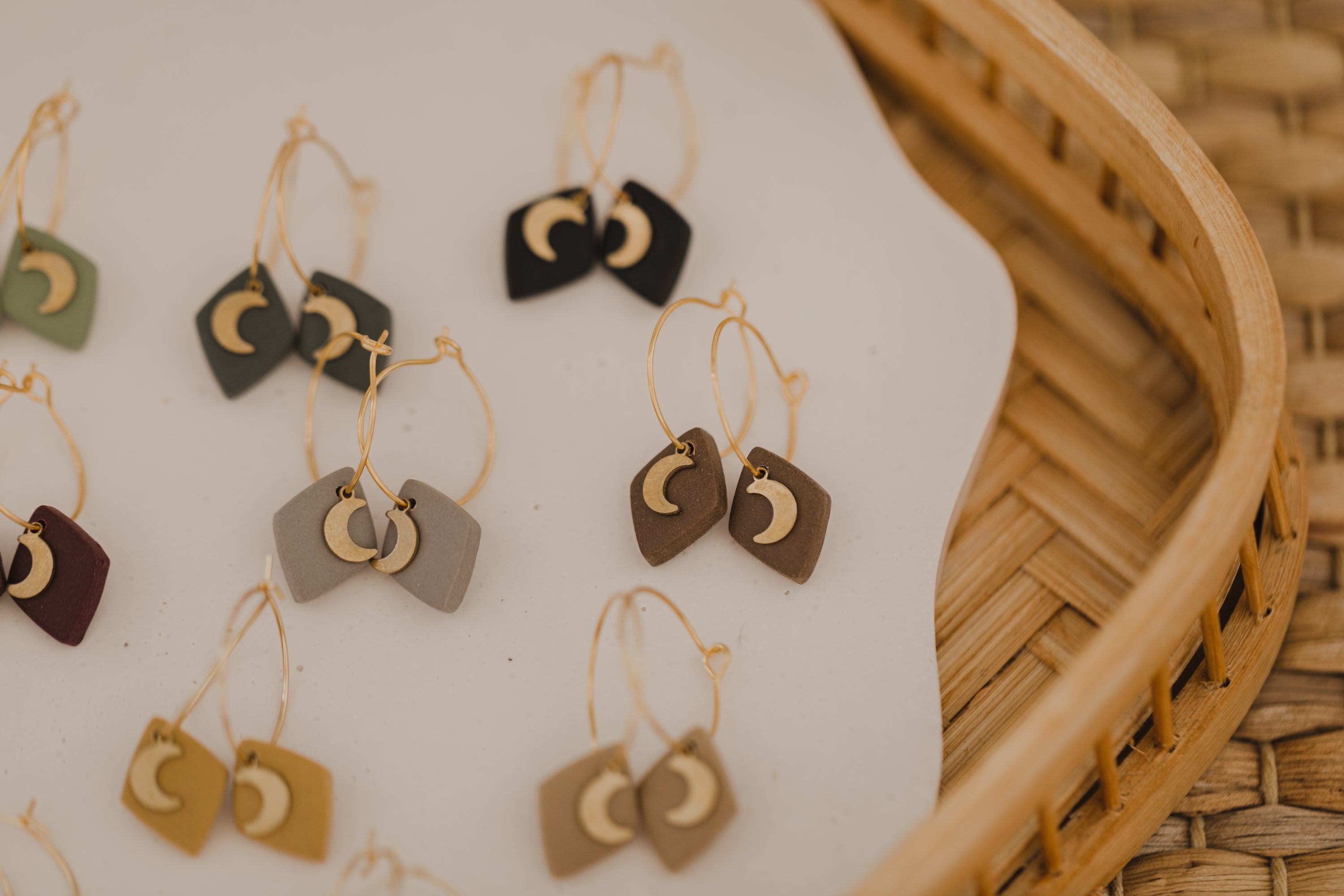 Hoop earrings with round polymer clay pendant and leaf
