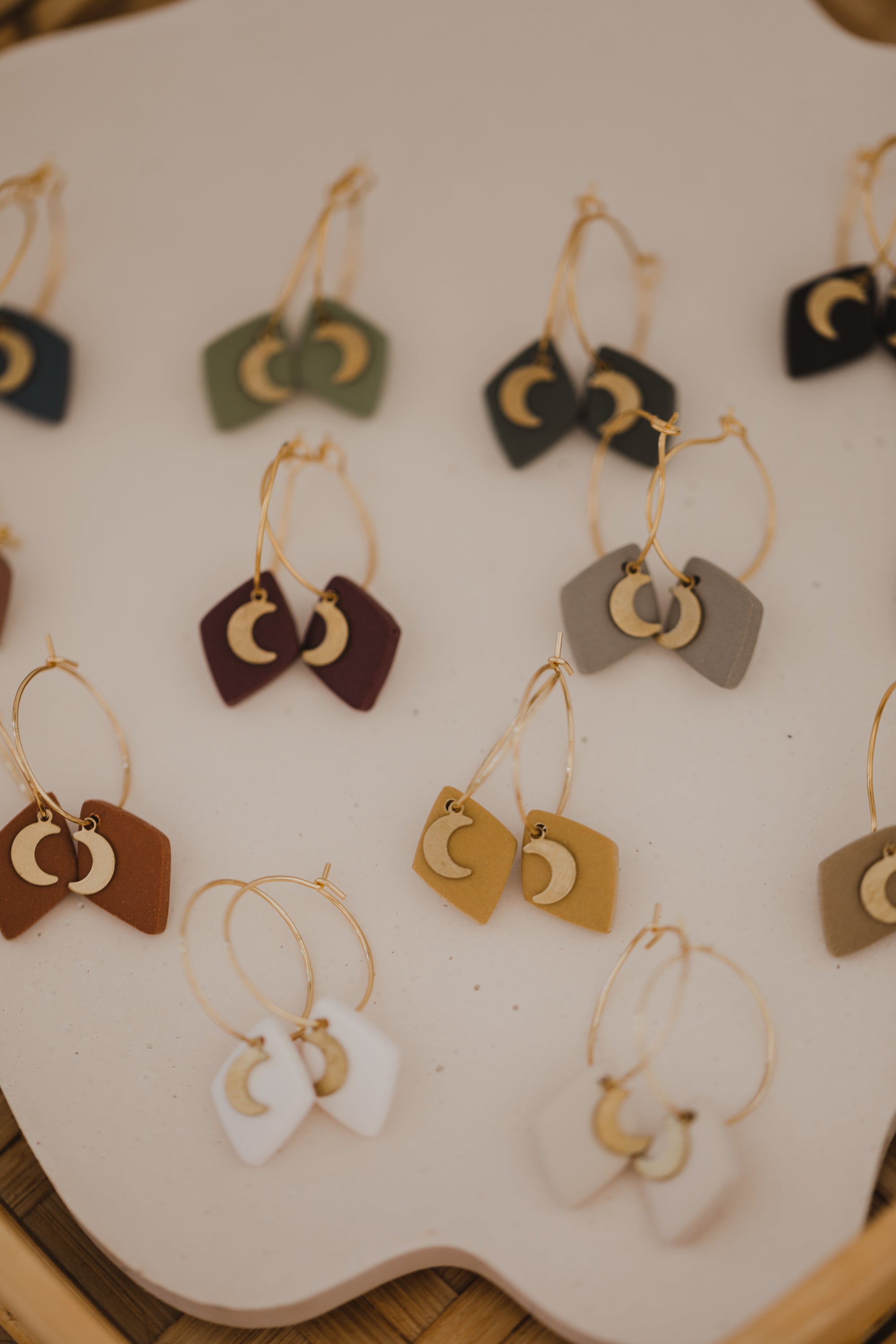 Hoop earrings with round polymer clay pendant and leaf