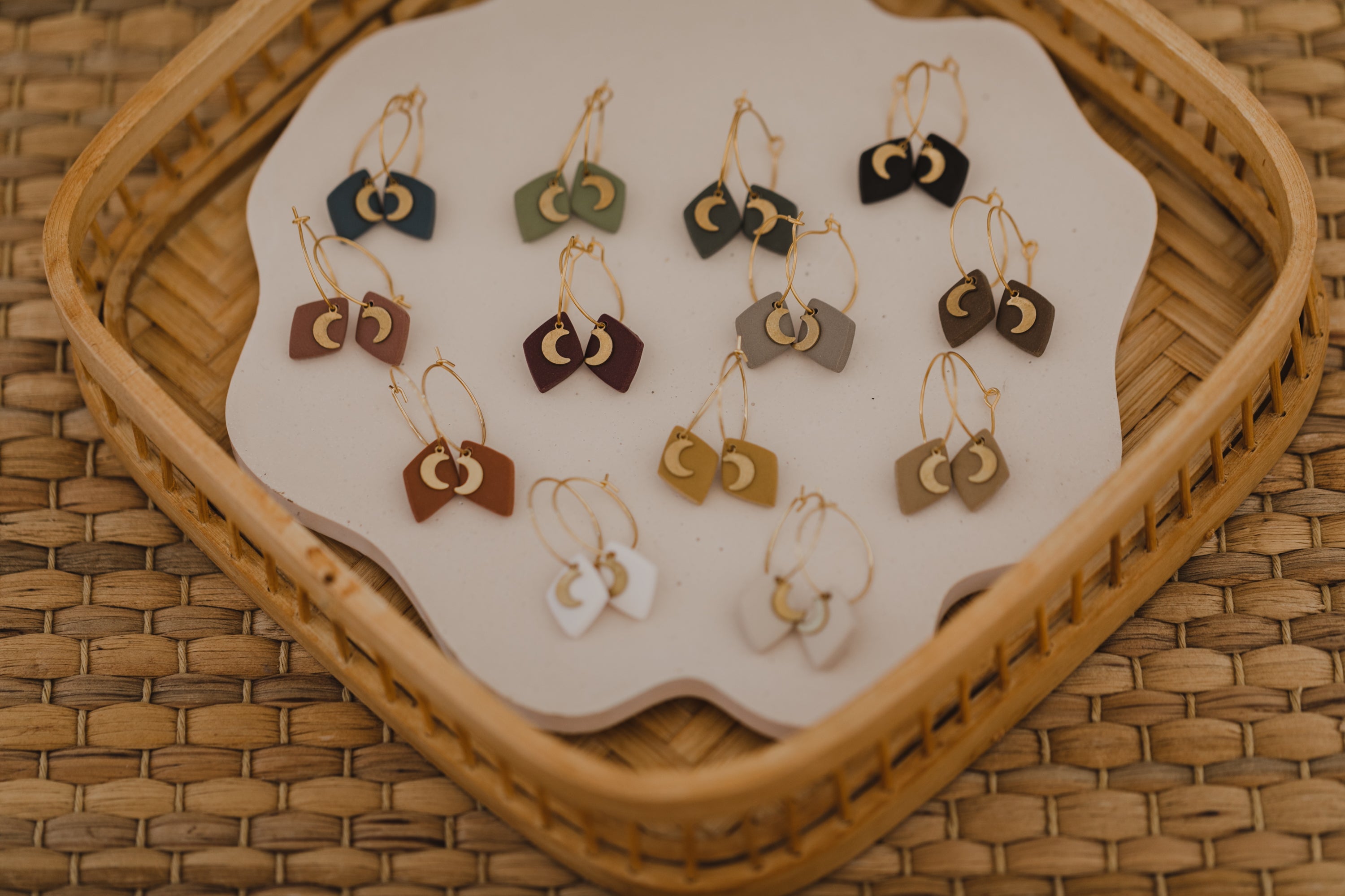 Hoop earrings with round polymer clay pendant and leaf