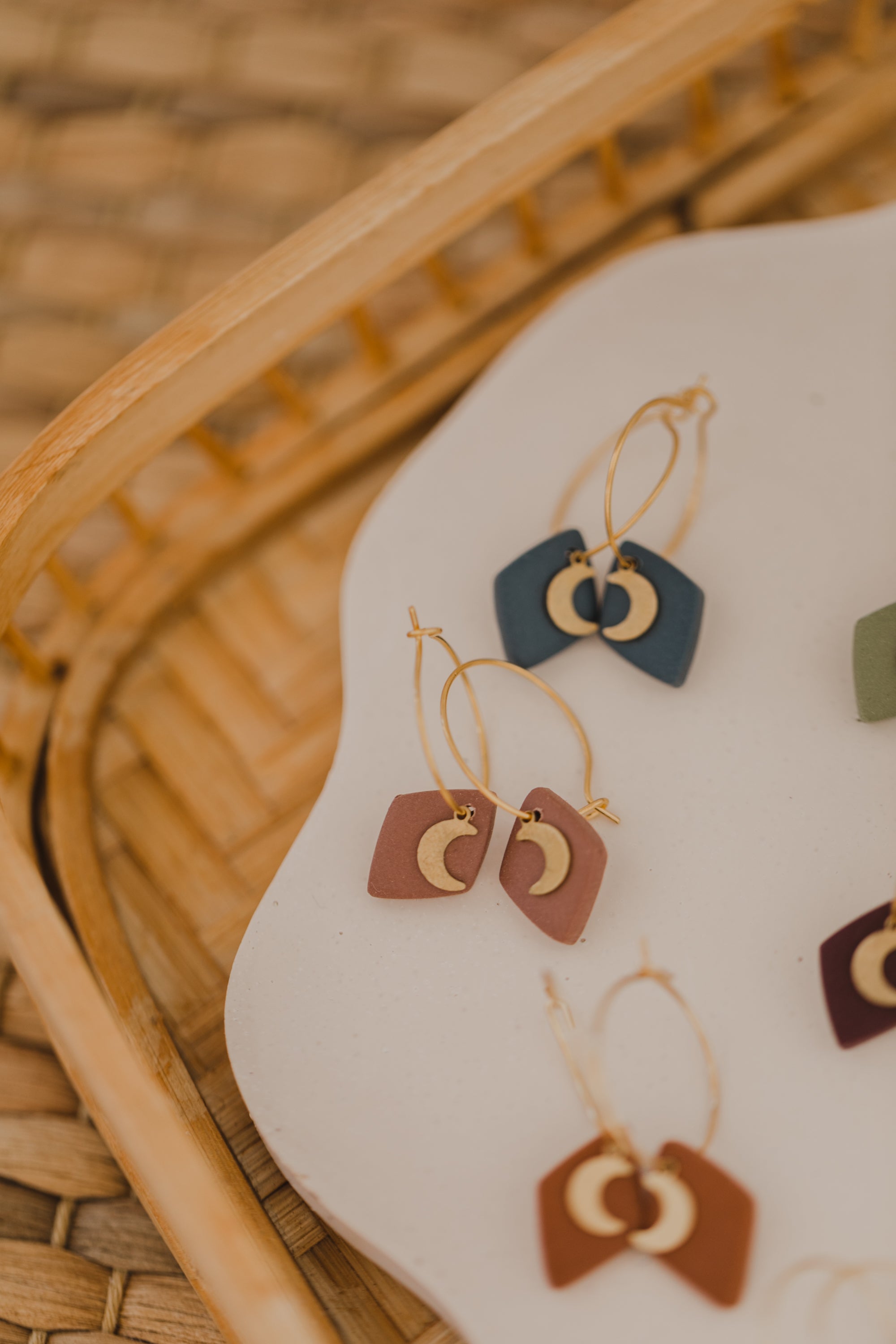 Hoop earrings with round polymer clay pendant and leaf