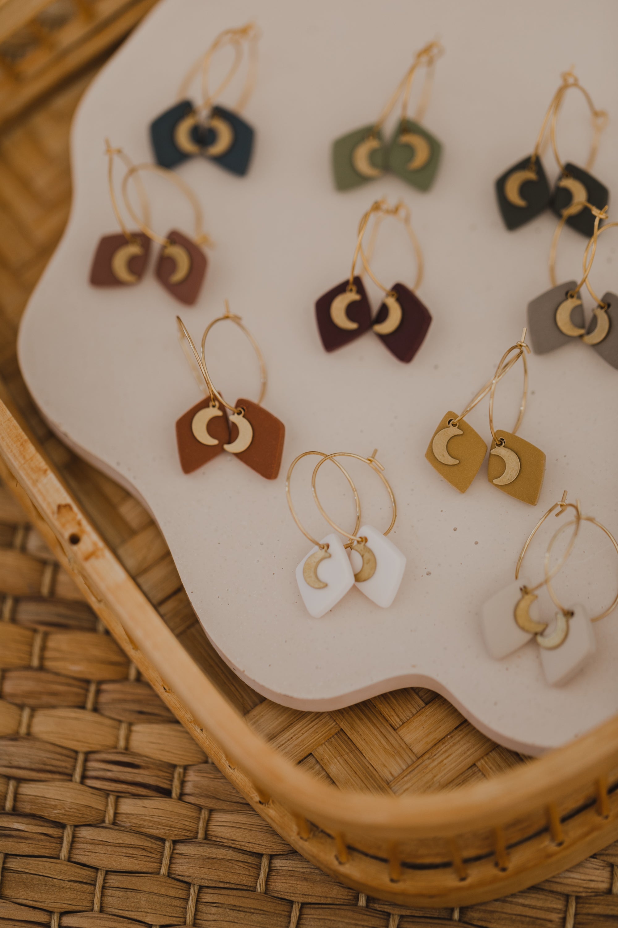 Hoop earrings with round polymer clay pendant and leaf