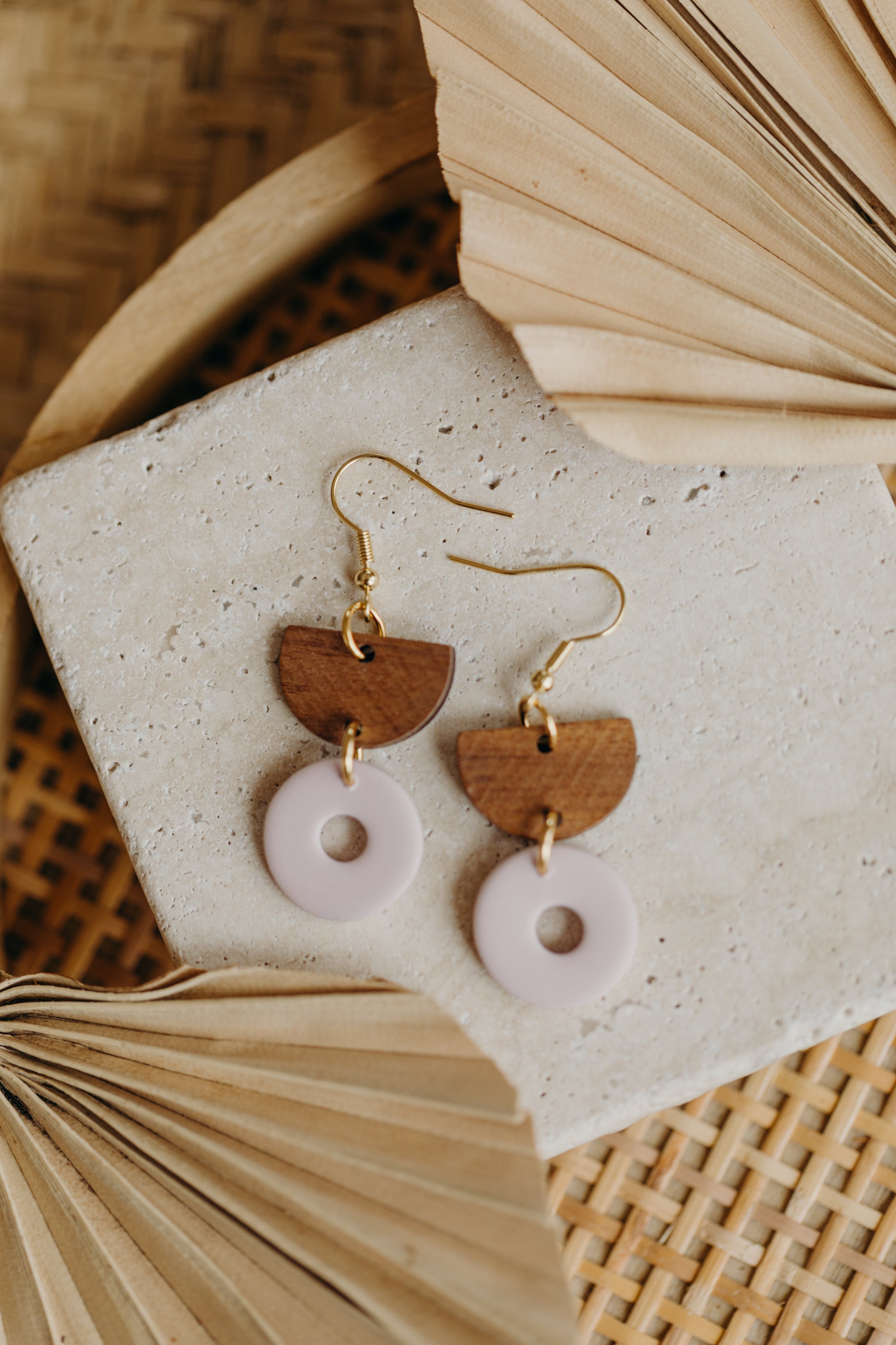 triangular polymer clay earrings in eucalyptus green with rectangular wooden pendant