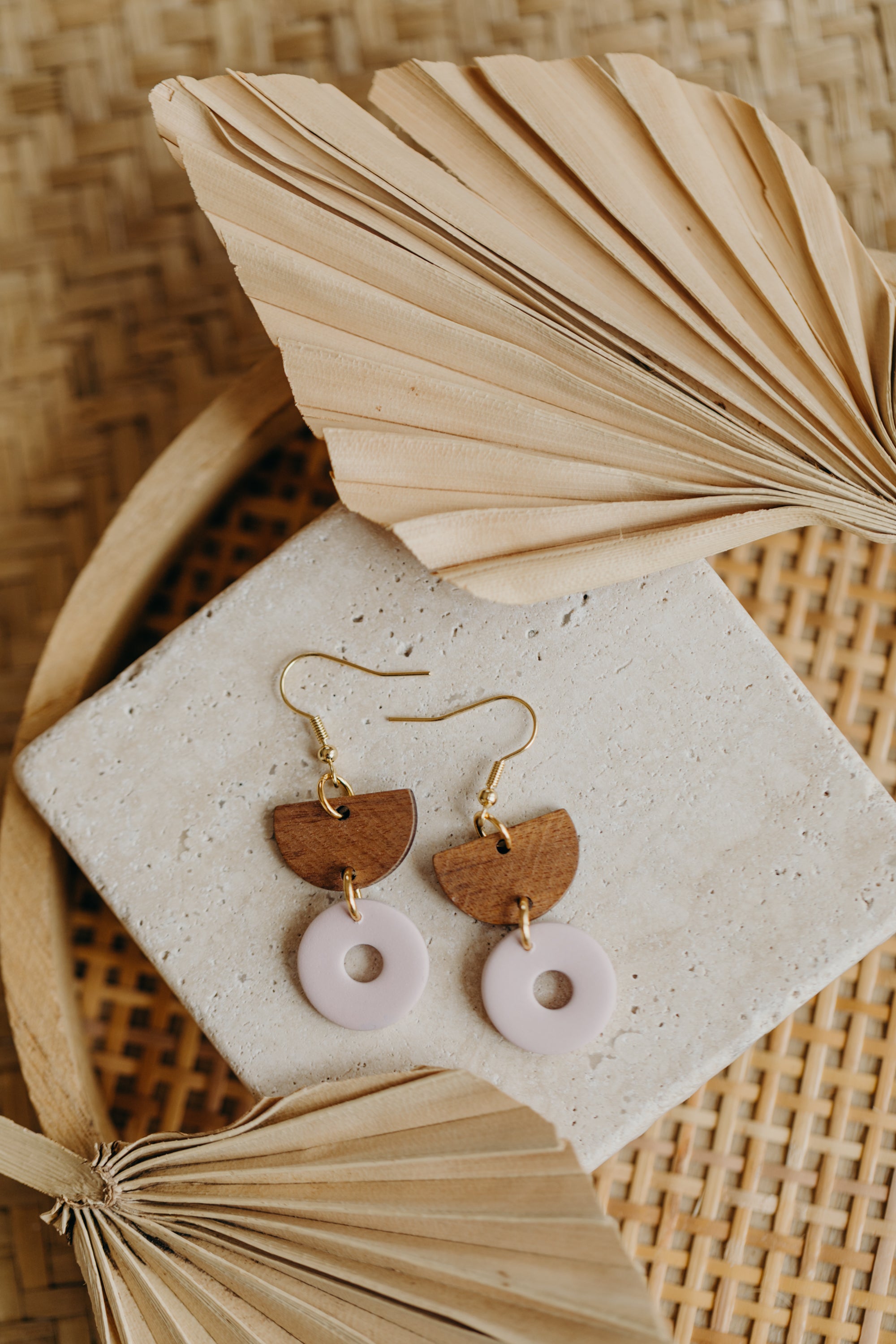 triangular polymer clay earrings in eucalyptus green with rectangular wooden pendant