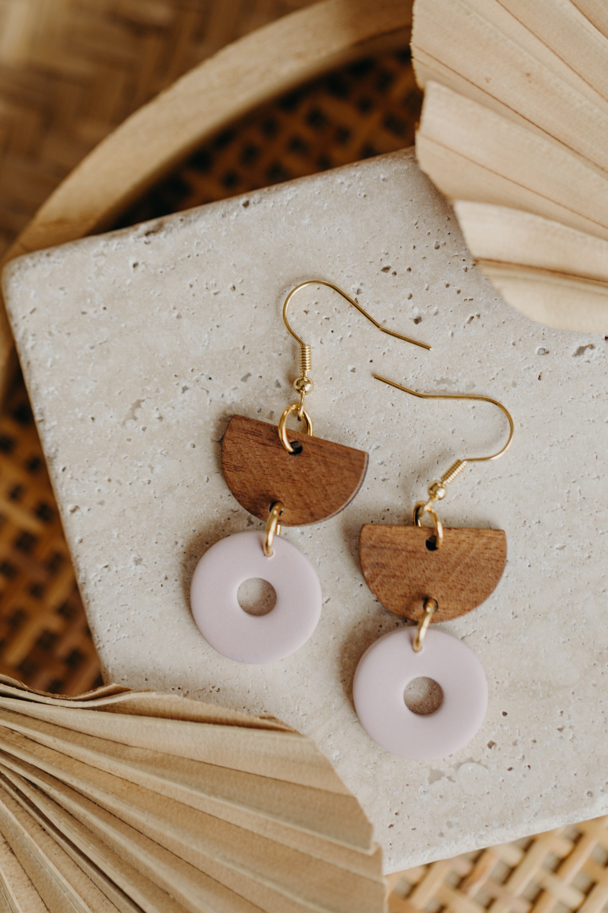 triangular polymer clay earrings in eucalyptus green with rectangular wooden pendant