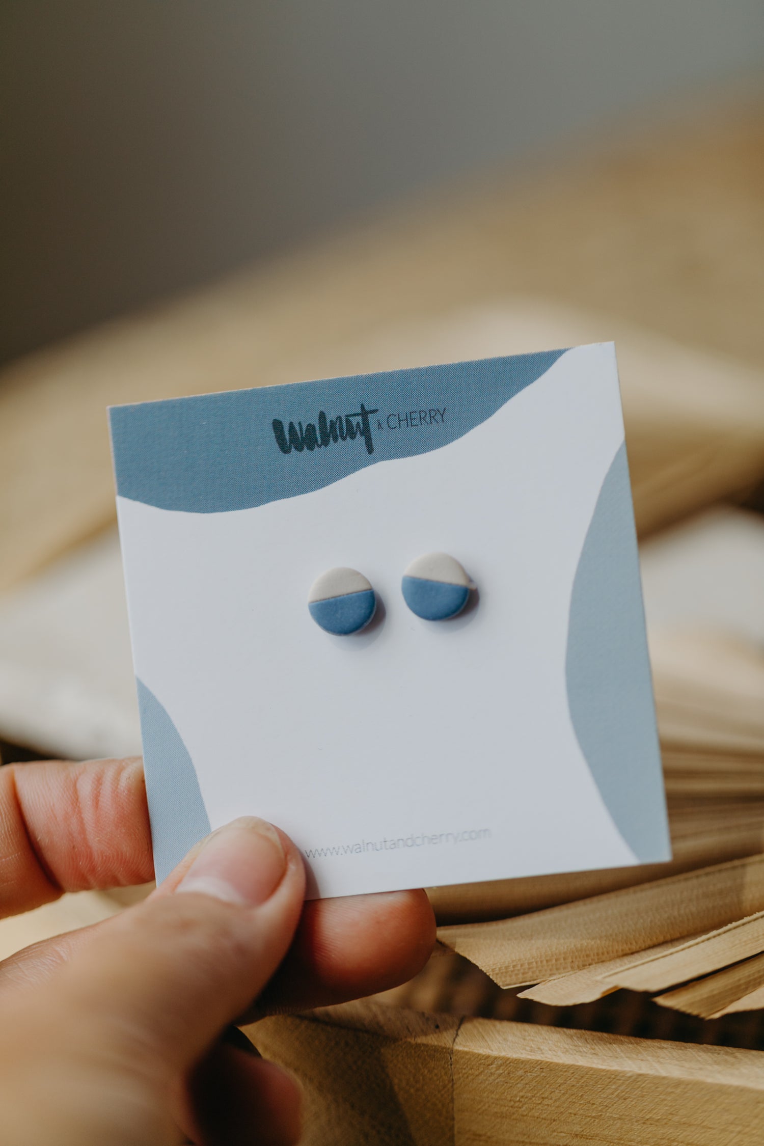 small round two-tone earrings made of polymer clay in pastel colors
