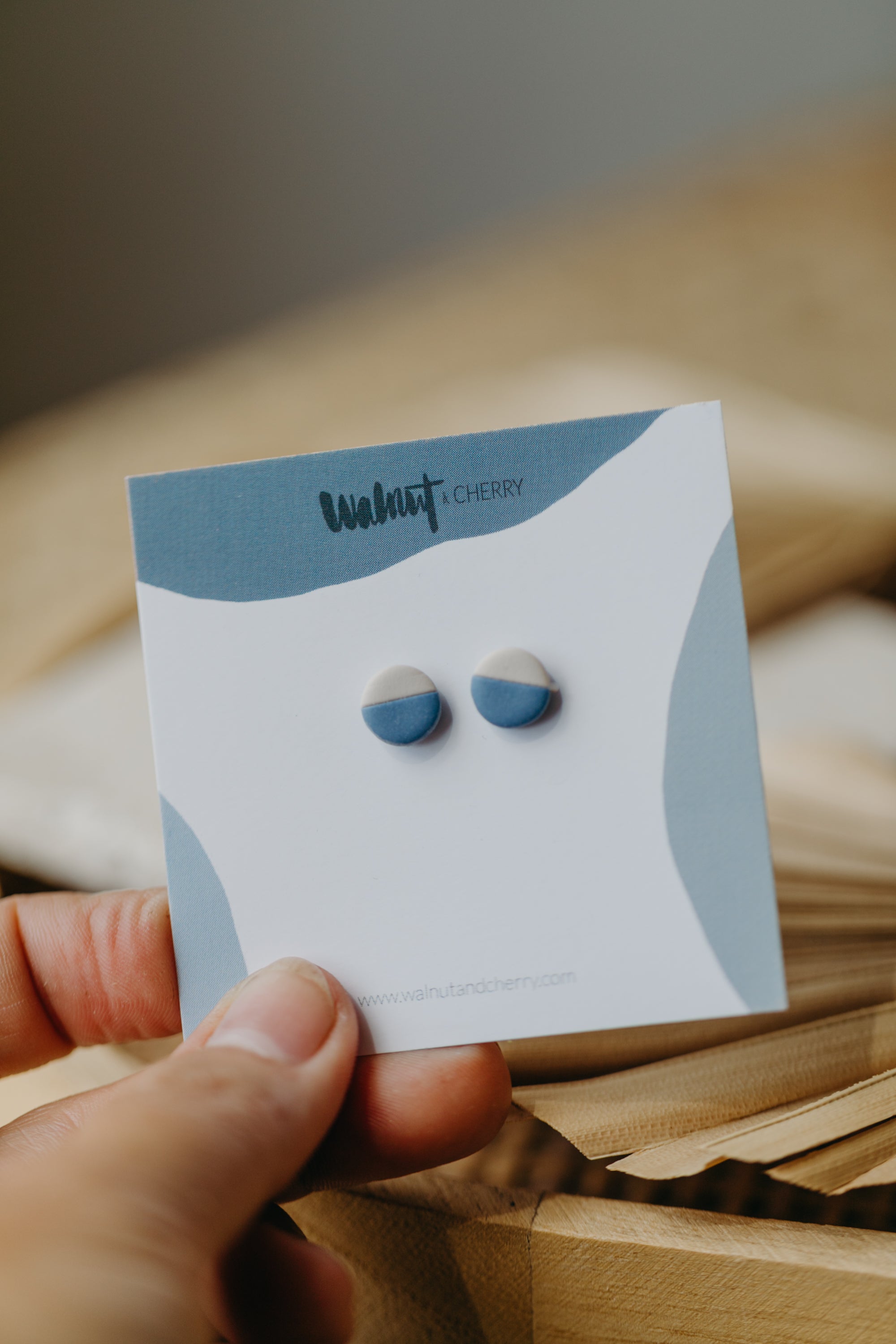 small round two-tone earrings made of polymer clay in pastel colors