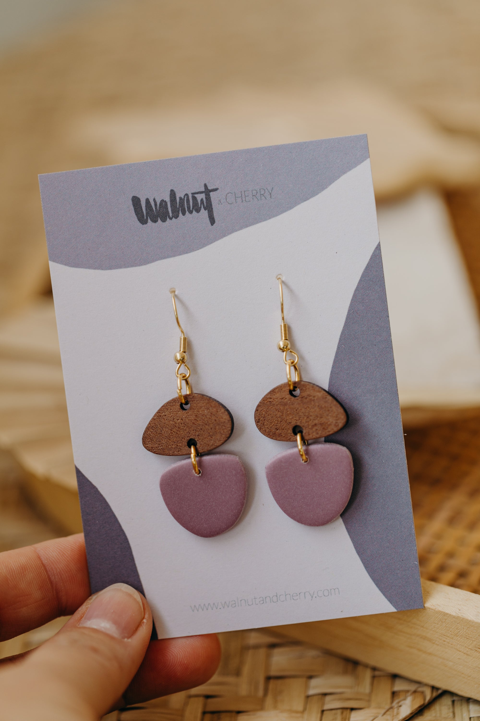 triangular polymer clay earrings in eucalyptus green with rectangular wooden pendant