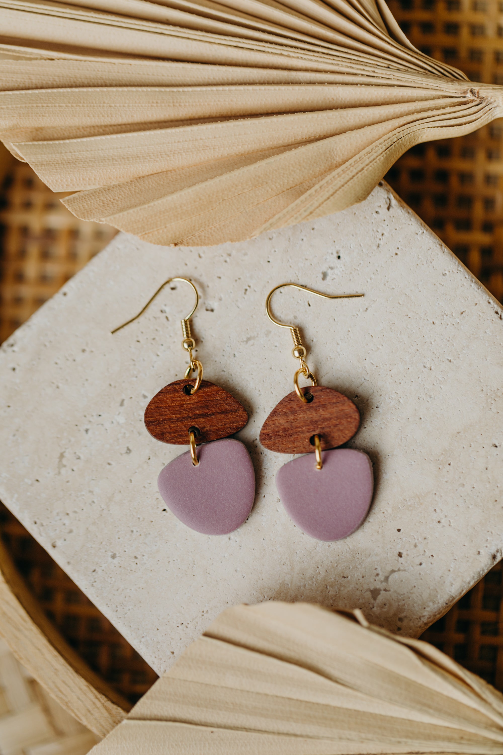 triangular polymer clay earrings in eucalyptus green with rectangular wooden pendant