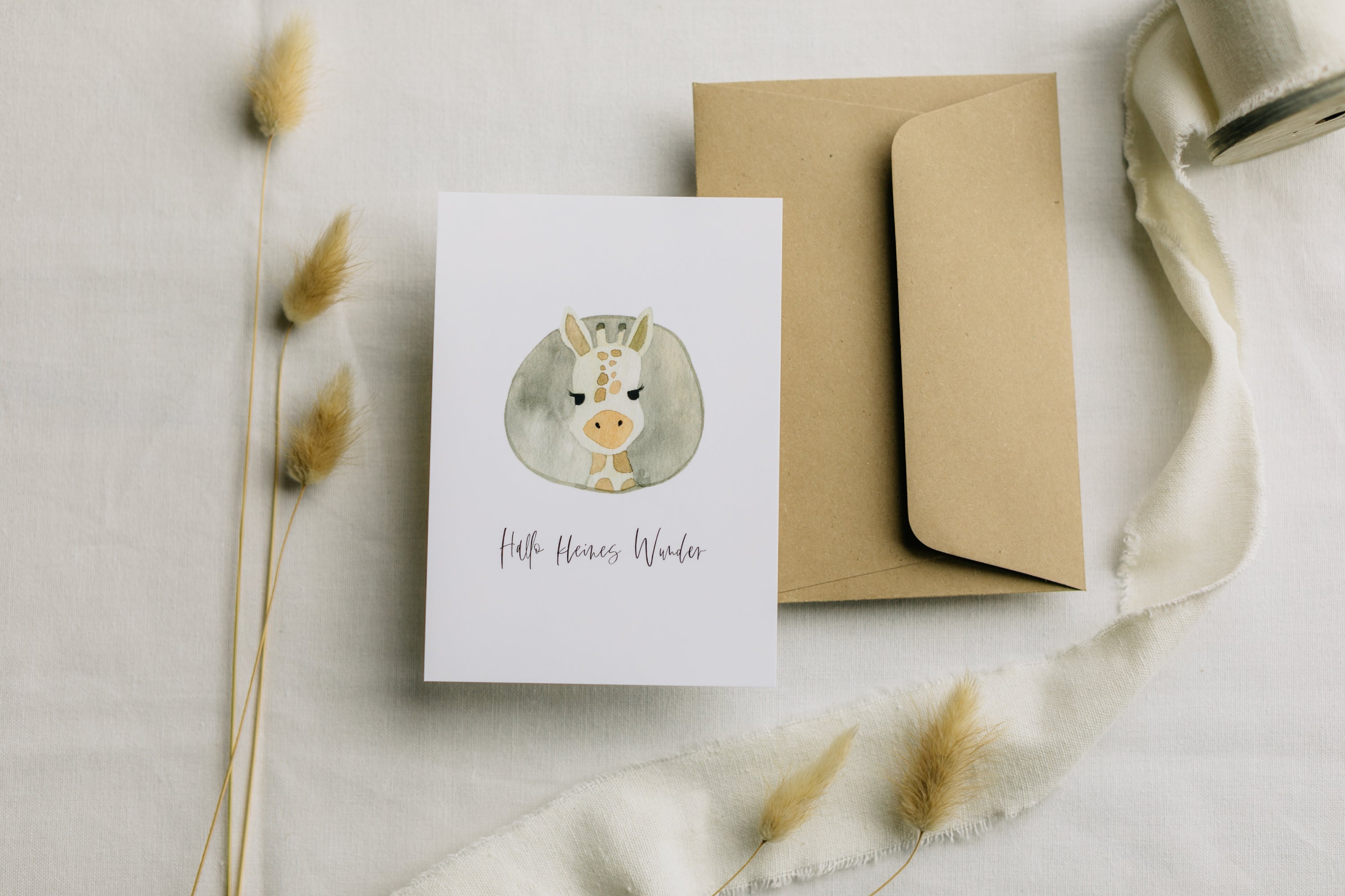 Postcard Giraffe with the print "Hello little miracle"
