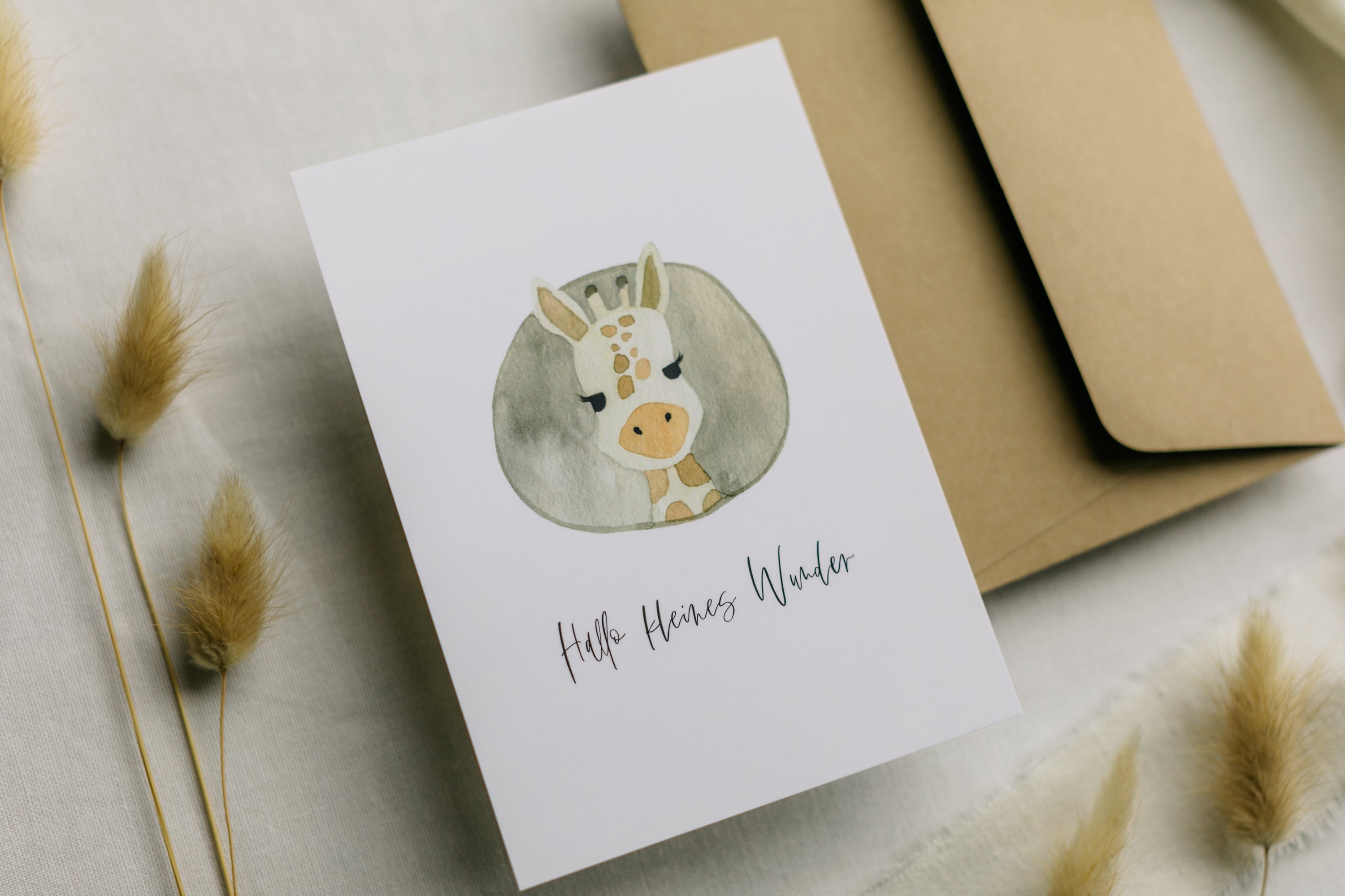 Postcard Giraffe with the print "Hello little miracle"