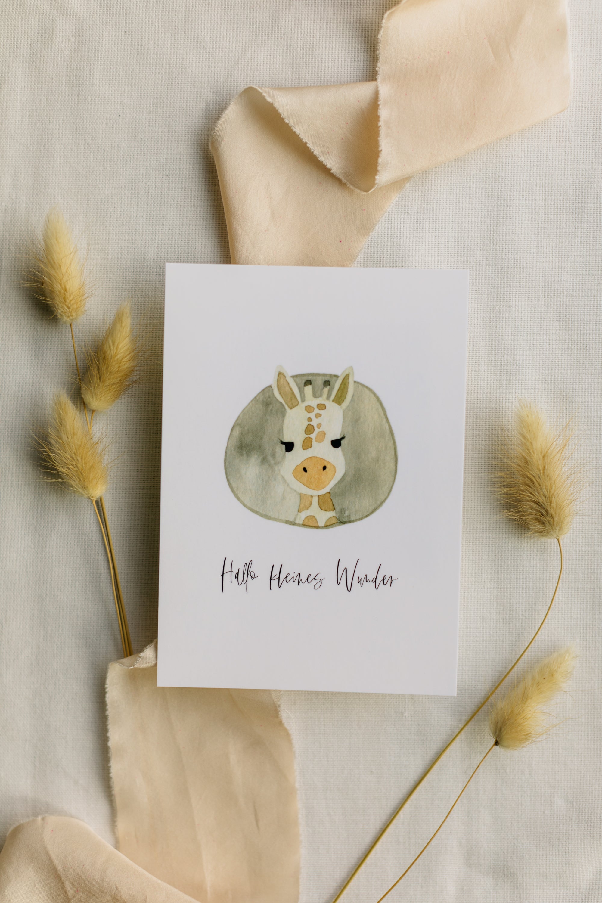 Postcard Giraffe with the print "Hello little miracle"