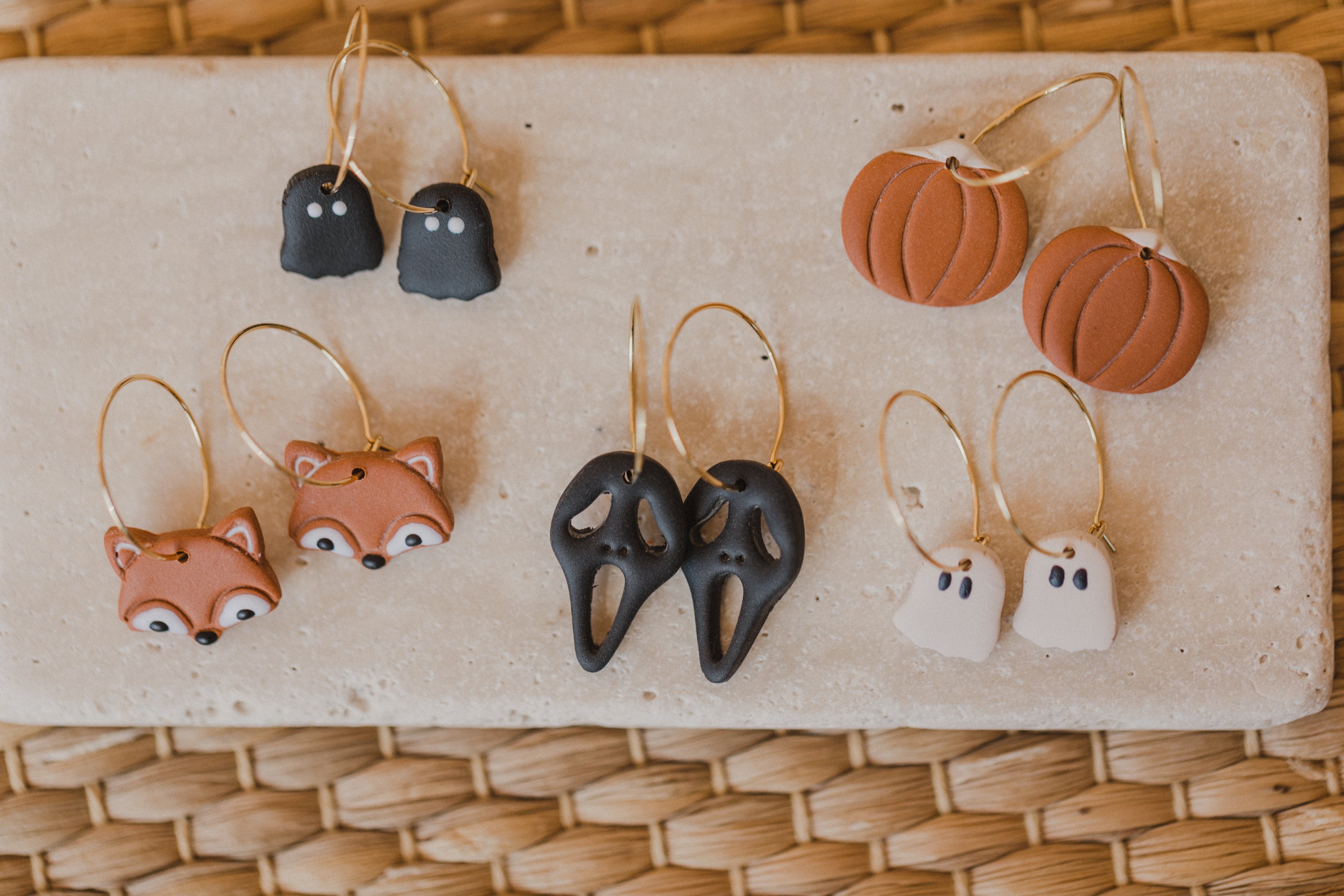 golden earrings with acrylic in white, petrol and brown