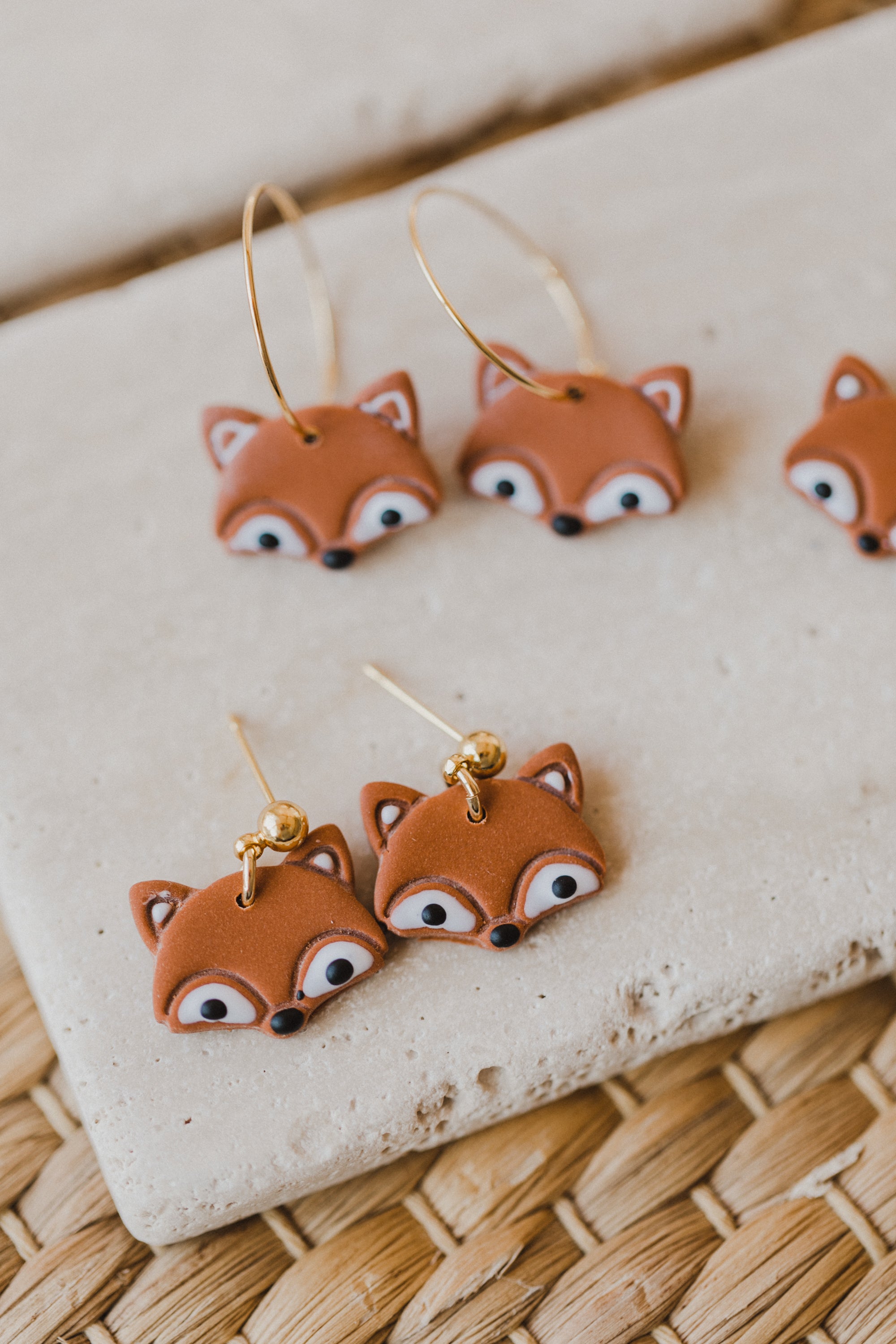 golden earrings with acrylic in white, petrol and brown