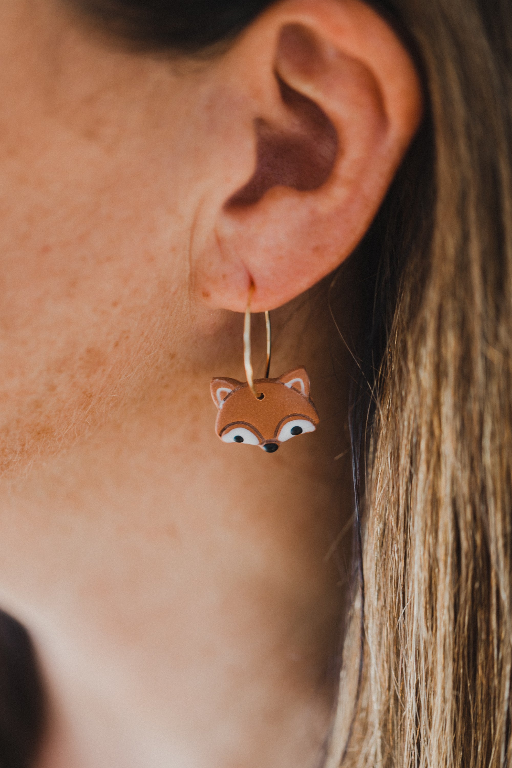 golden earrings with acrylic in white, petrol and brown