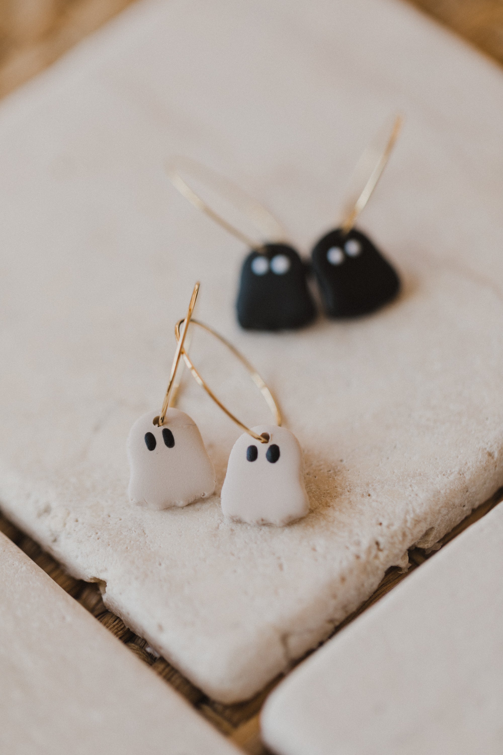 golden earrings with acrylic in white, petrol and brown