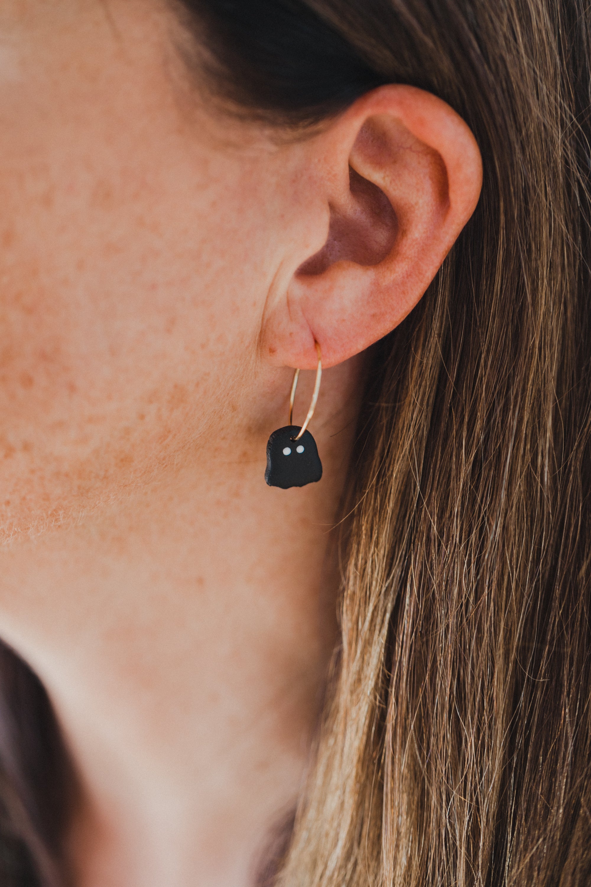 golden earrings with acrylic in white, petrol and brown