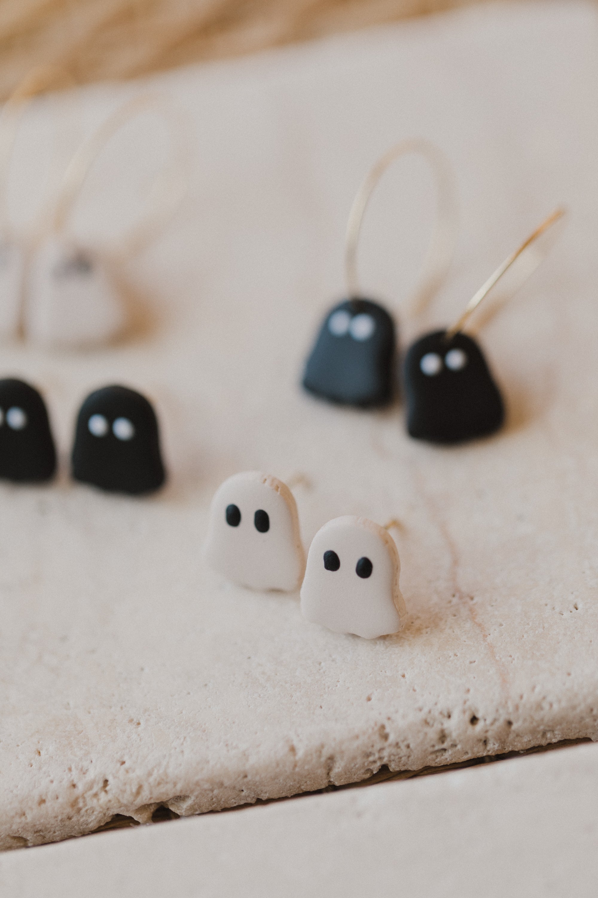 golden earrings with acrylic in white, petrol and brown