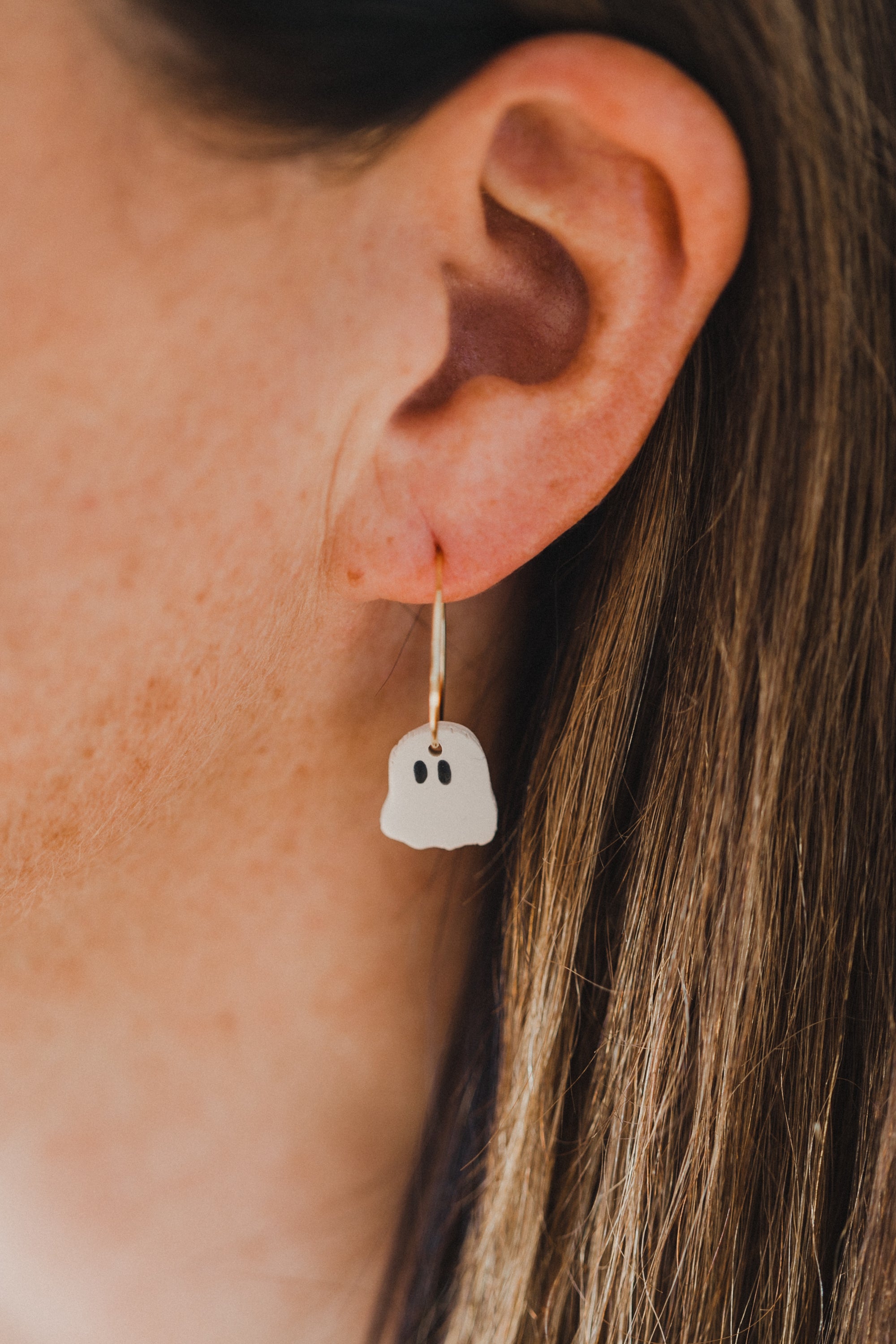 golden earrings with acrylic in white, petrol and brown