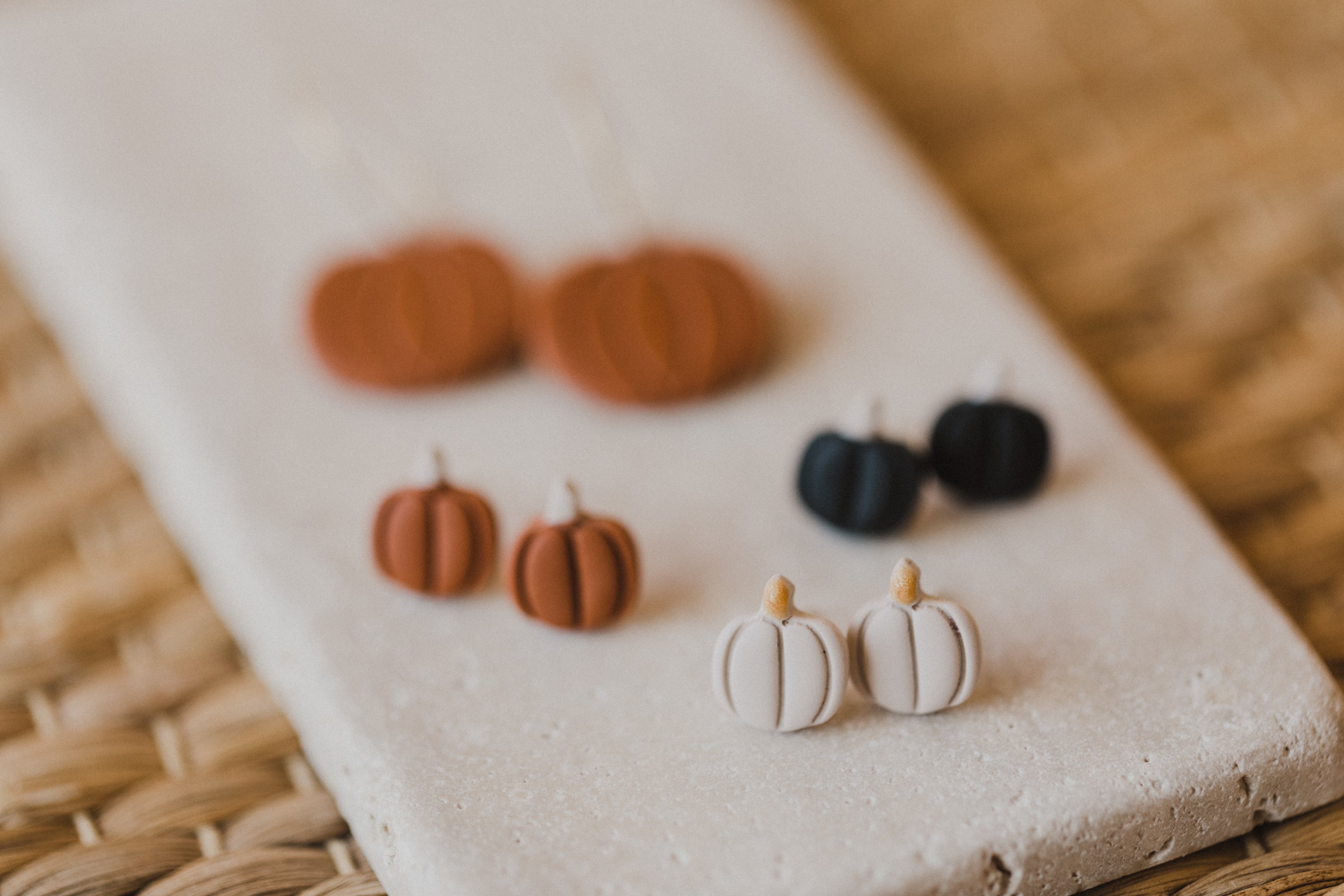 golden earrings with acrylic in white, petrol and brown