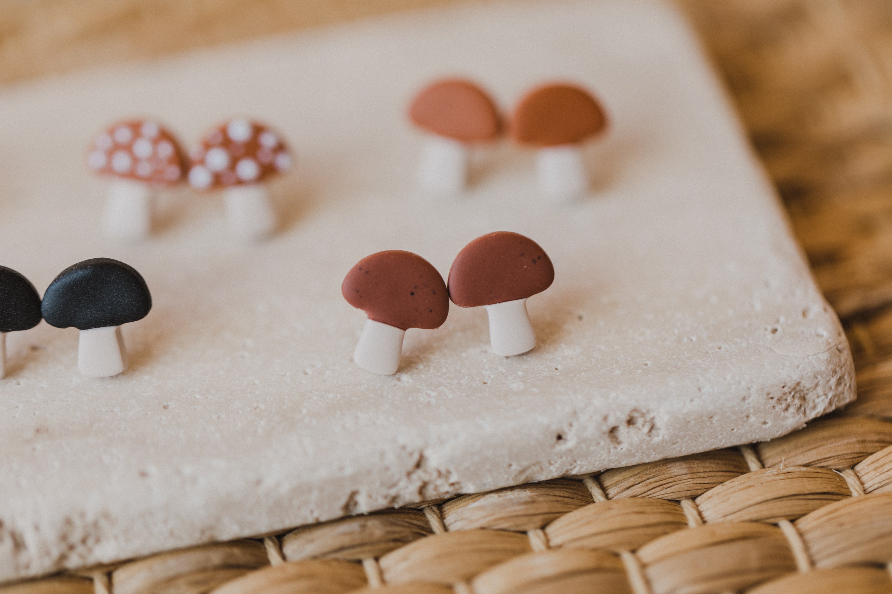 golden earrings with acrylic in white, petrol and brown