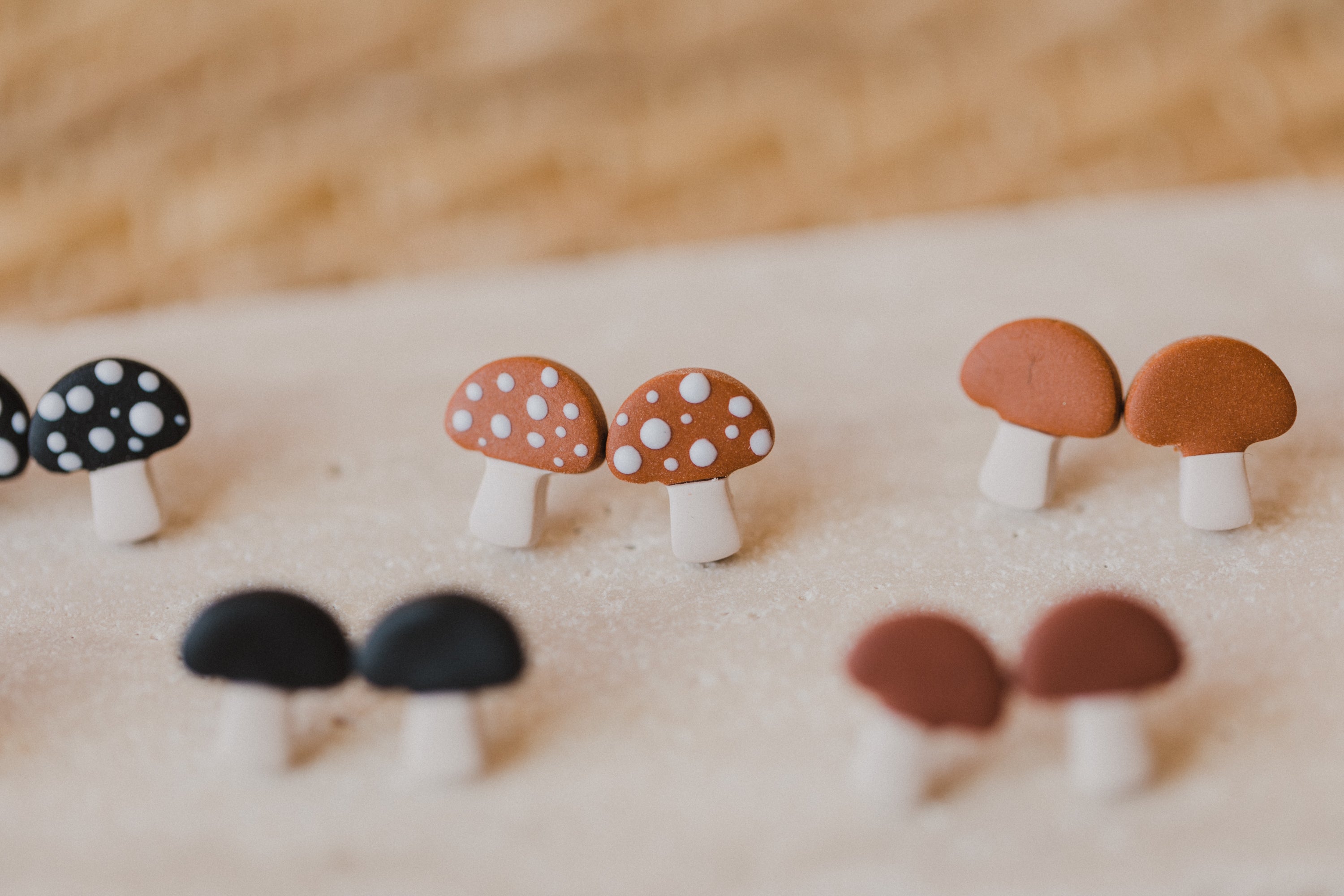 golden earrings with acrylic in white, petrol and brown
