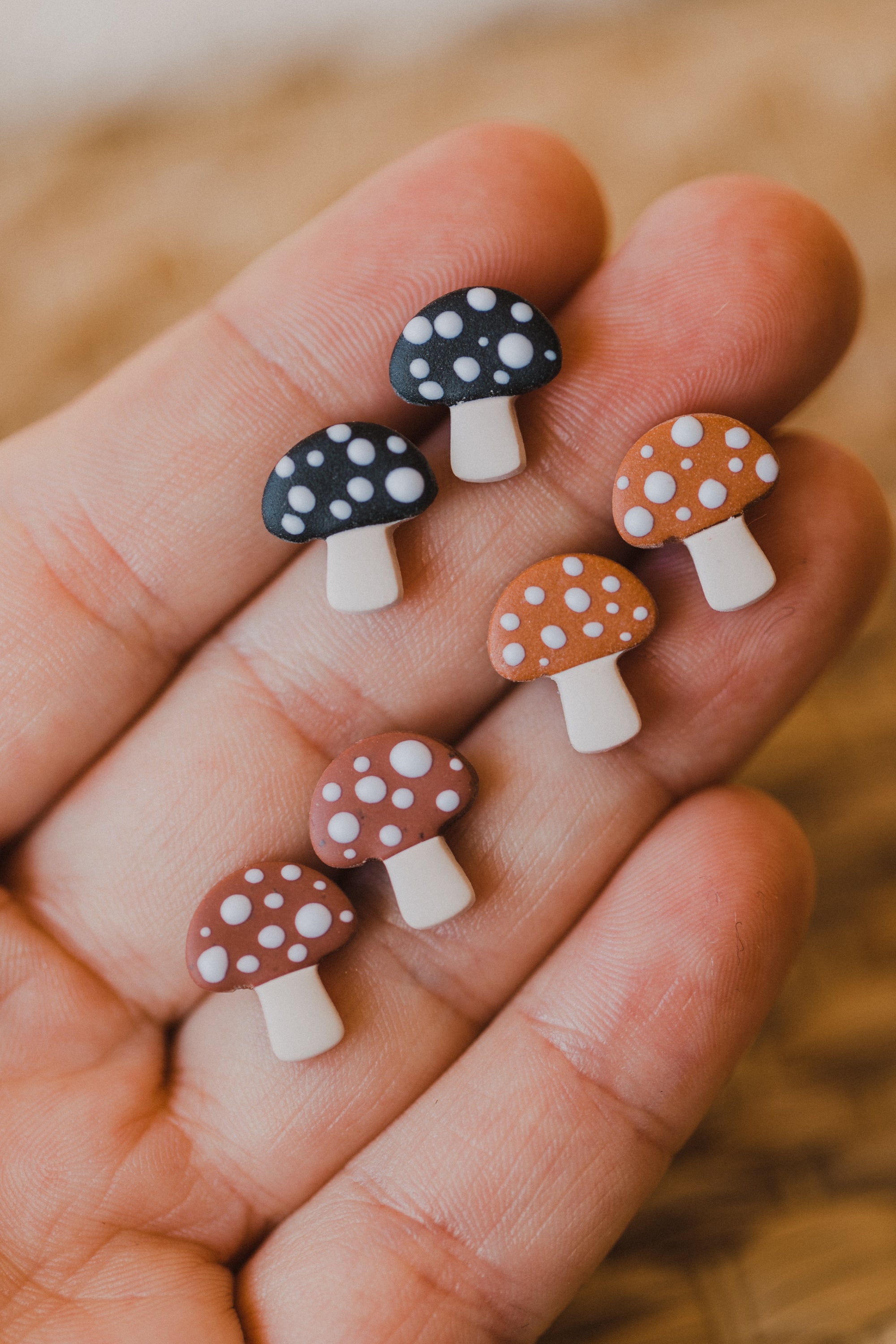 golden earrings with acrylic in white, petrol and brown