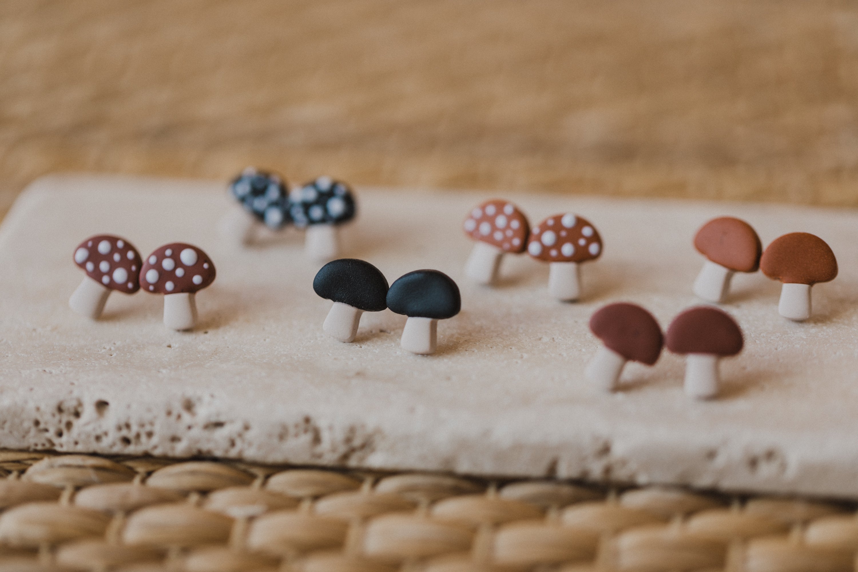 golden earrings with acrylic in white, petrol and brown