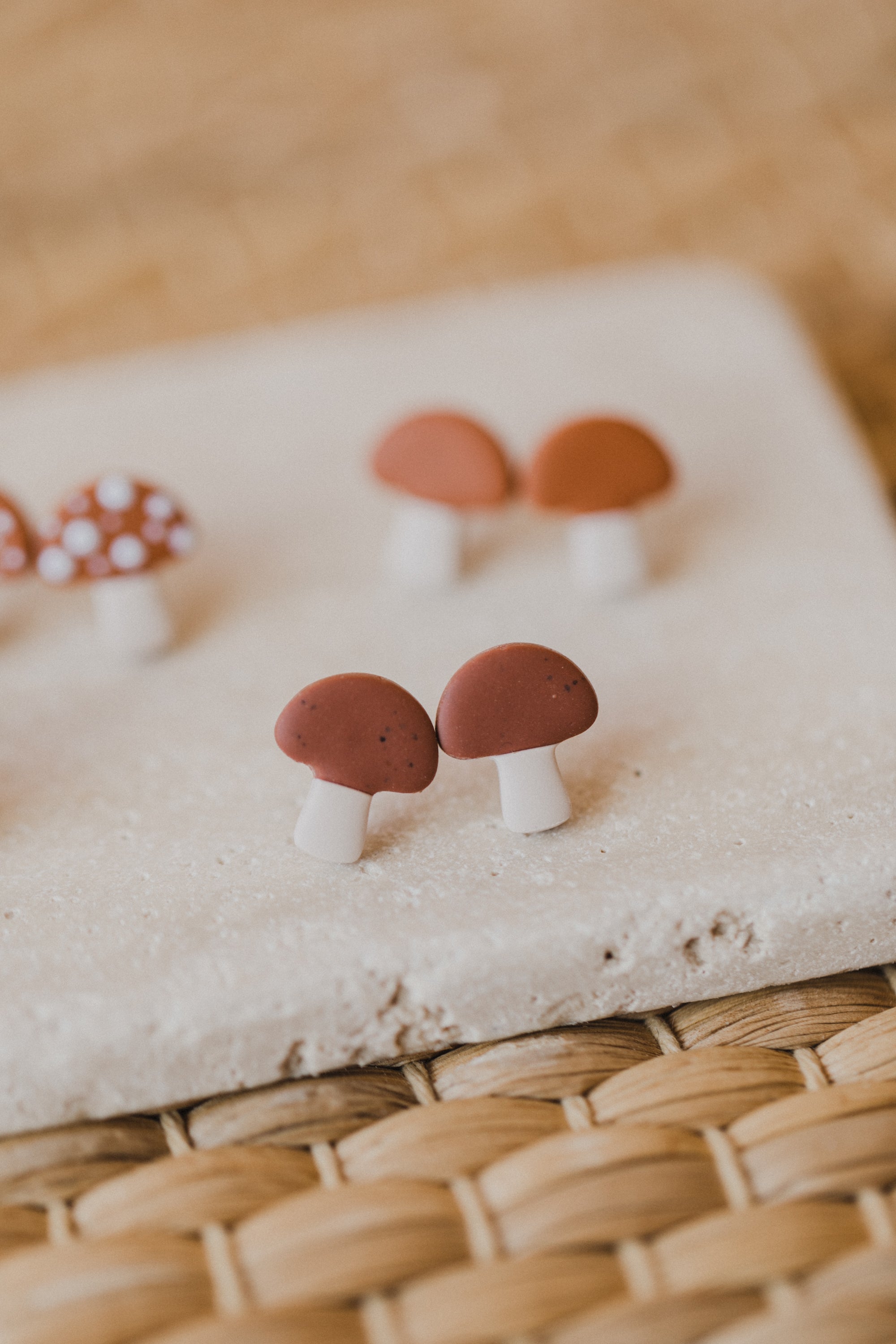 golden earrings with acrylic in white, petrol and brown