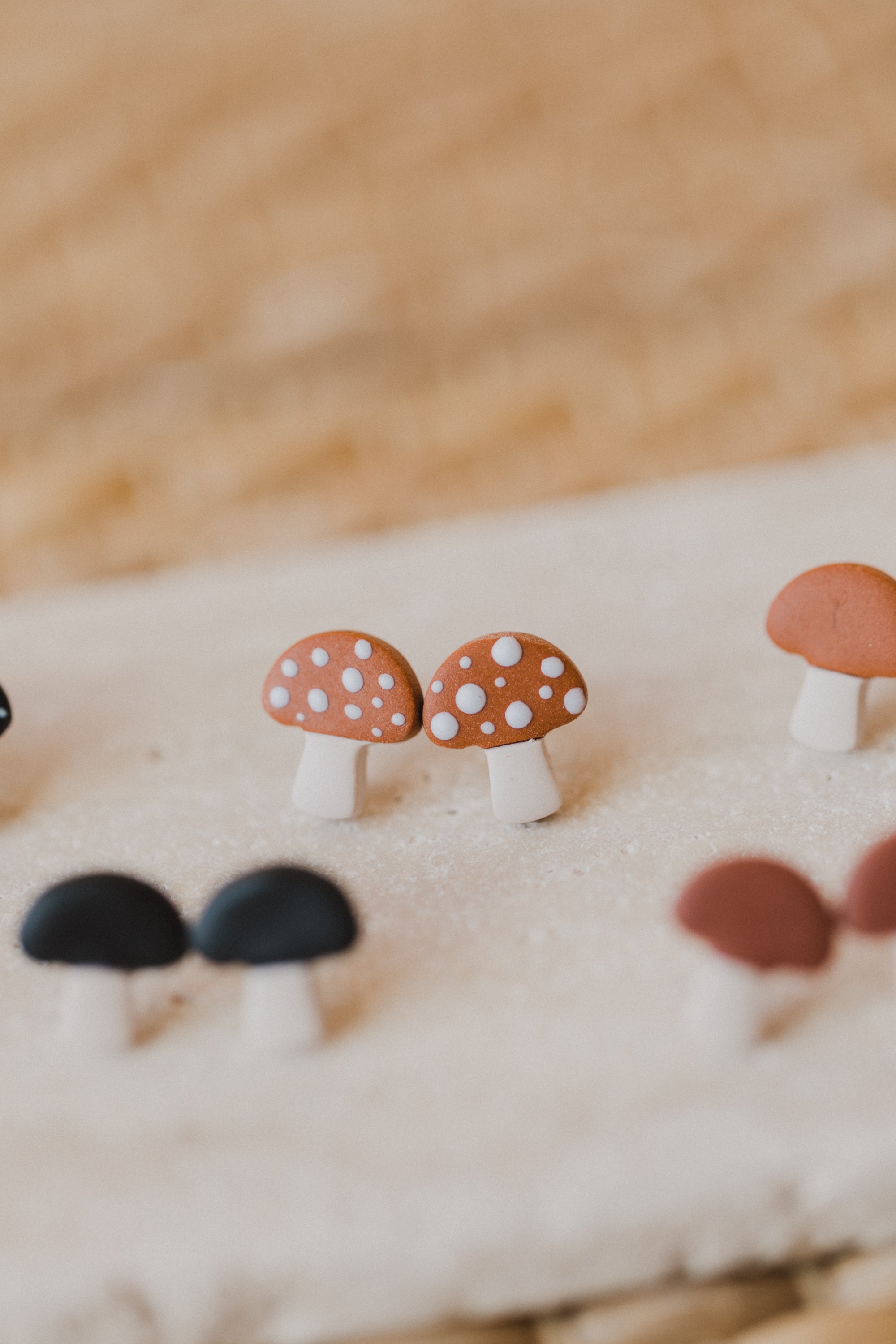 golden earrings with acrylic in white, petrol and brown