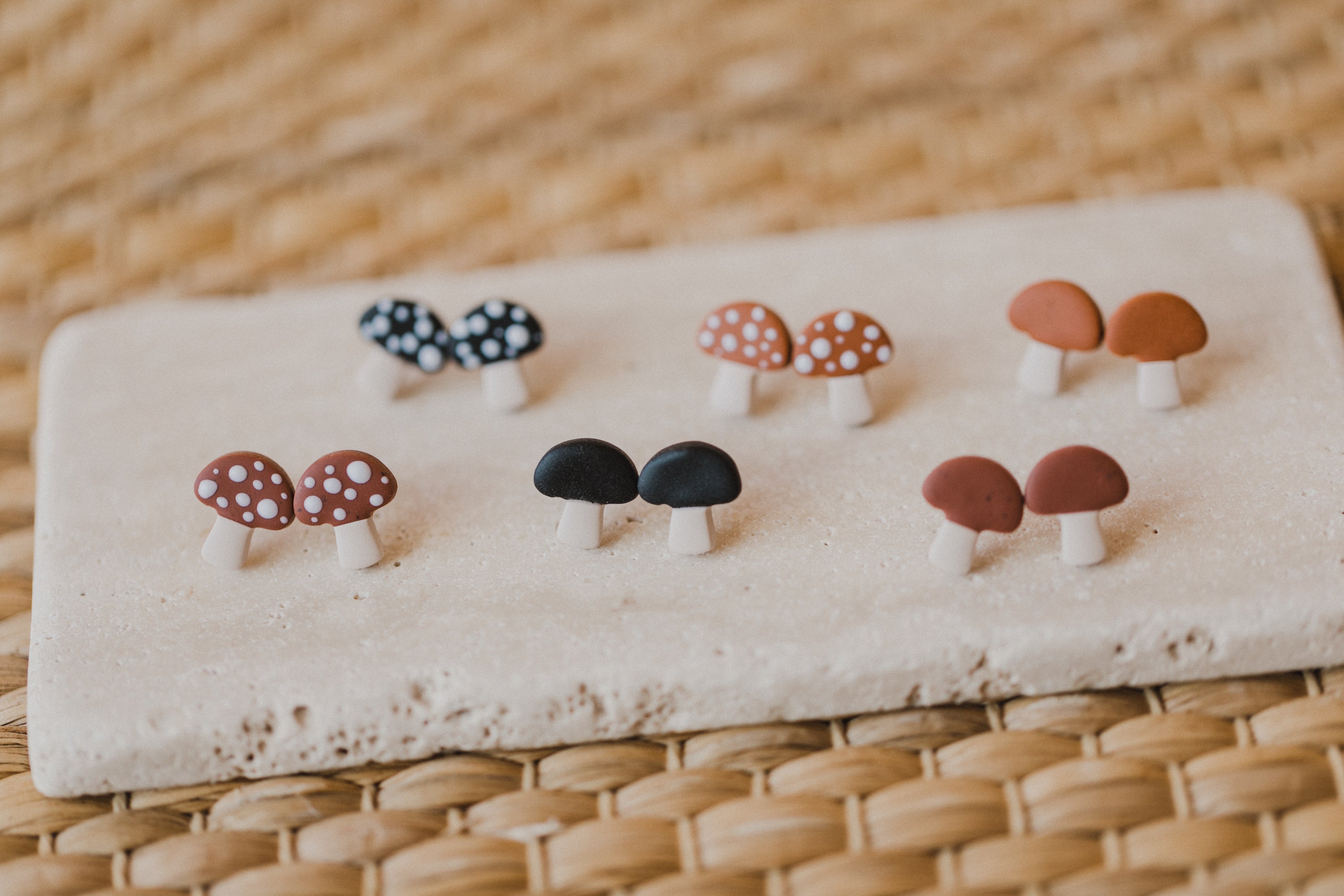 golden earrings with acrylic in white, petrol and brown