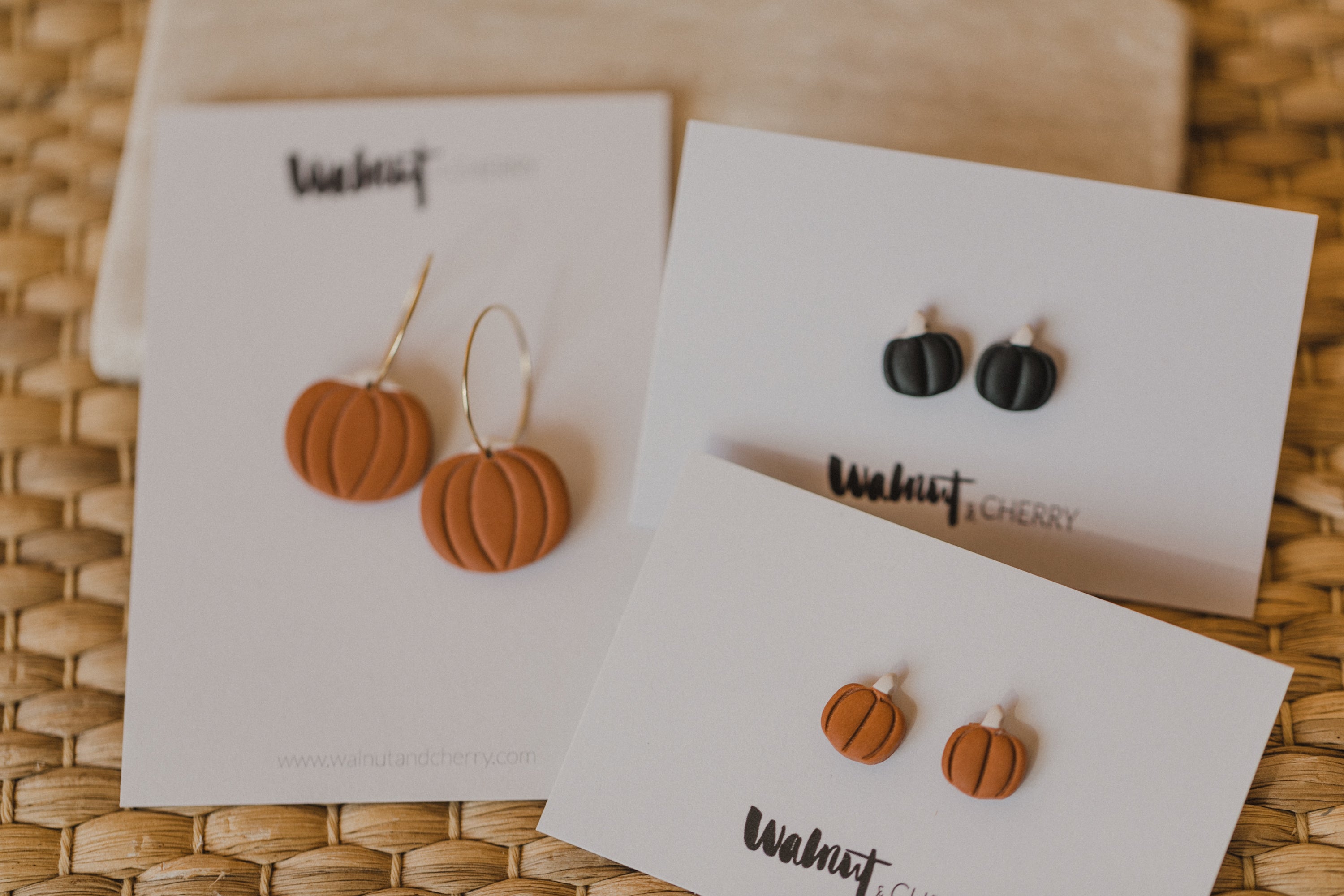 golden earrings with acrylic in white, petrol and brown