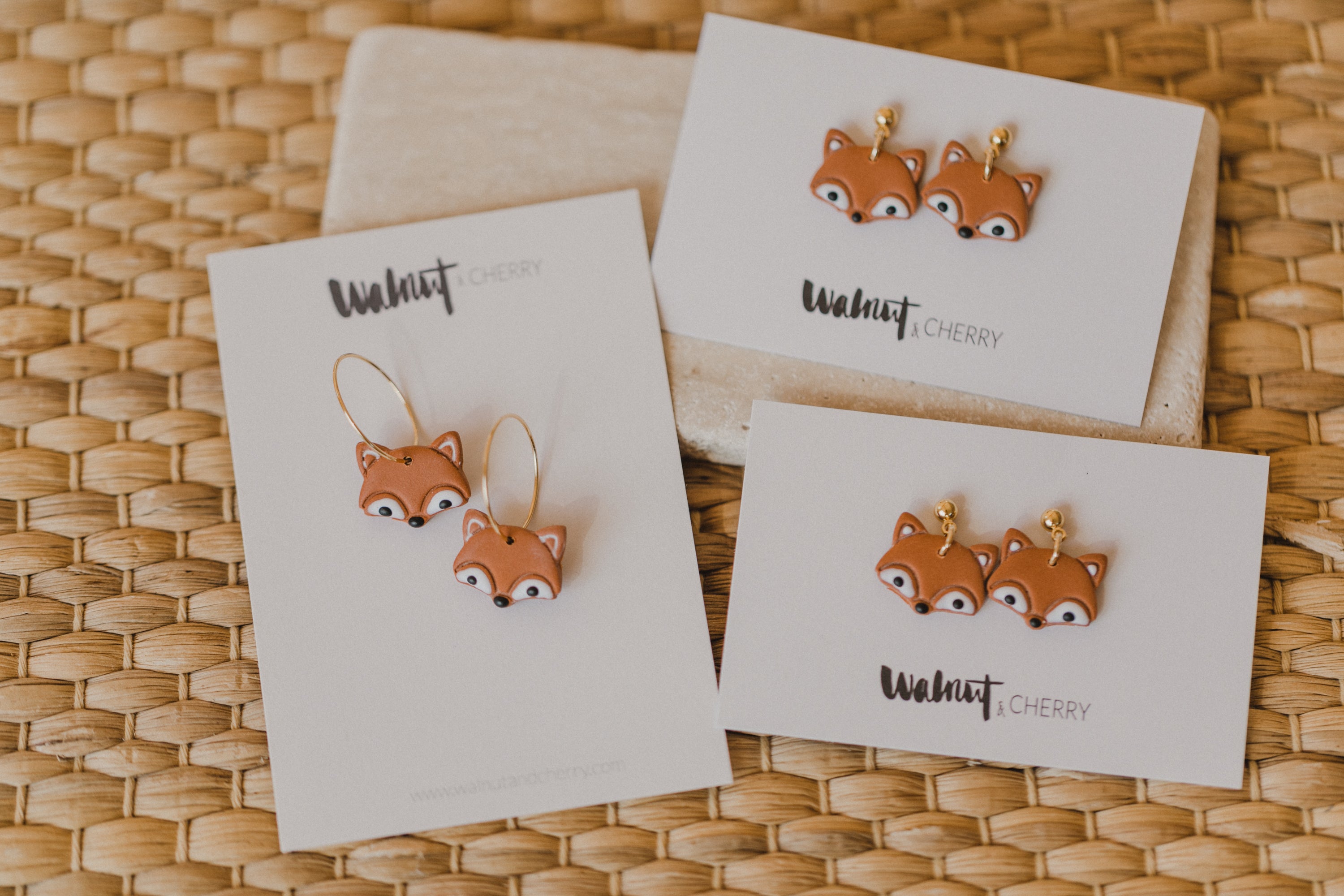 golden earrings with acrylic in white, petrol and brown