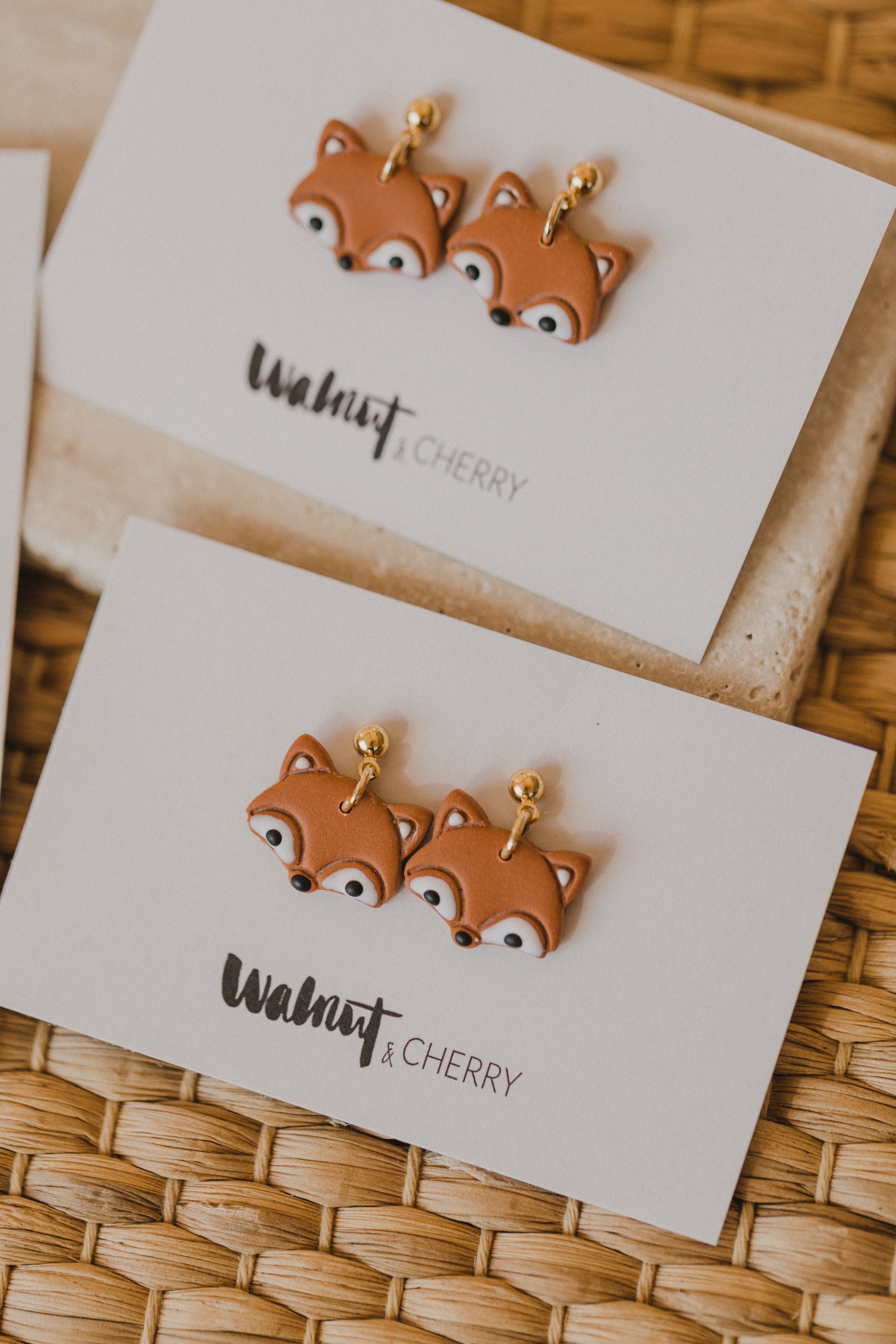 golden earrings with acrylic in white, petrol and brown