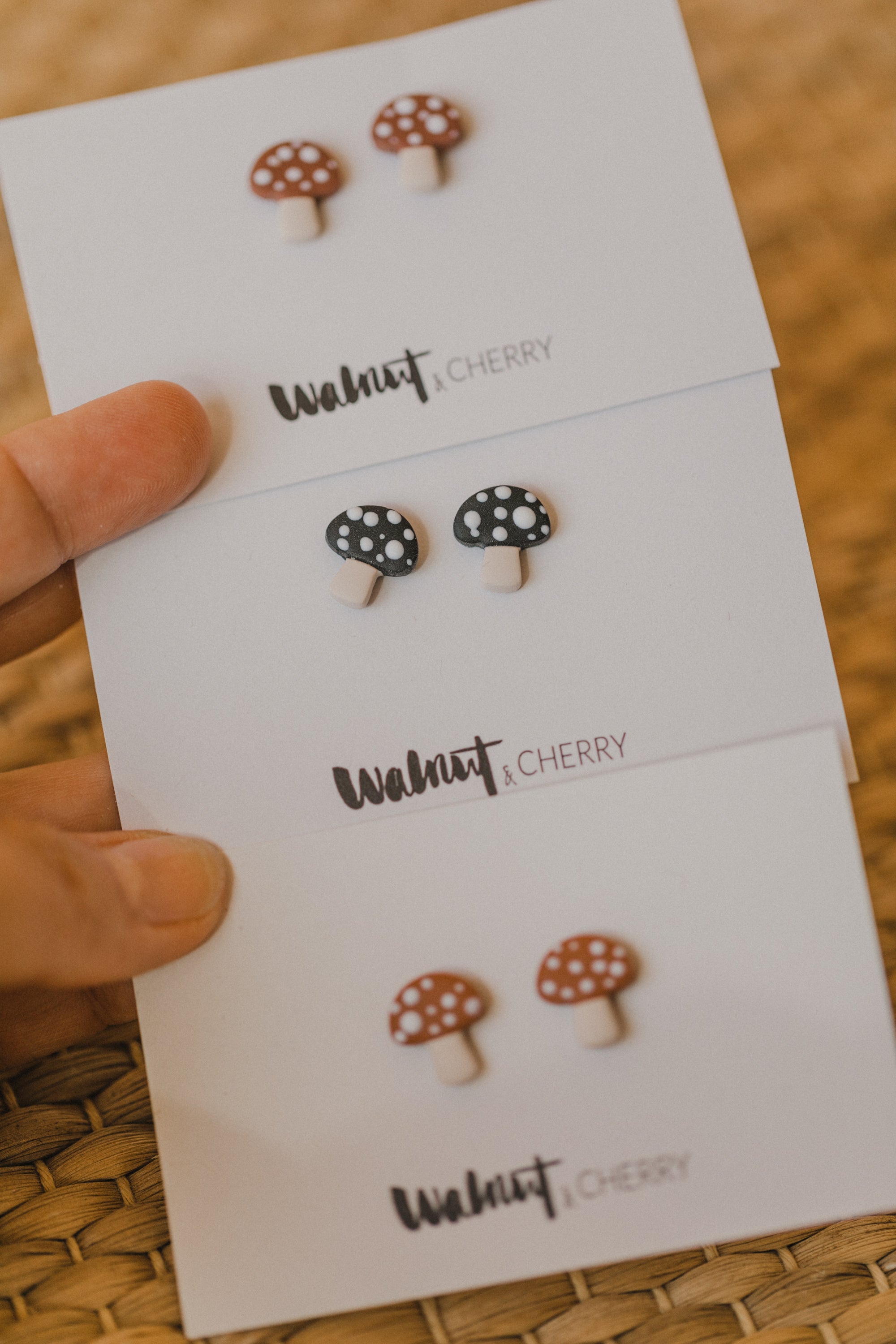 golden earrings with acrylic in white, petrol and brown