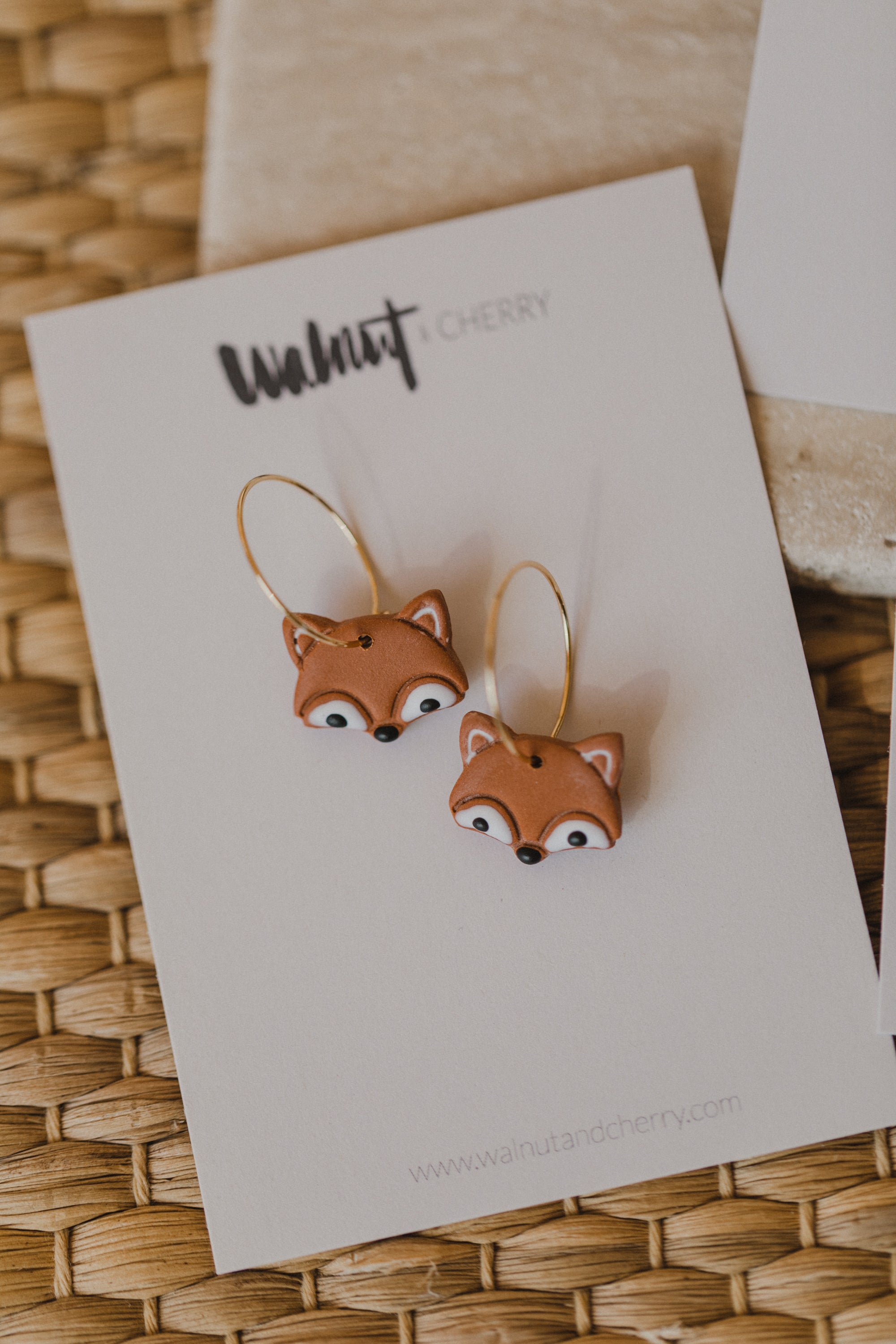 golden earrings with acrylic in white, petrol and brown