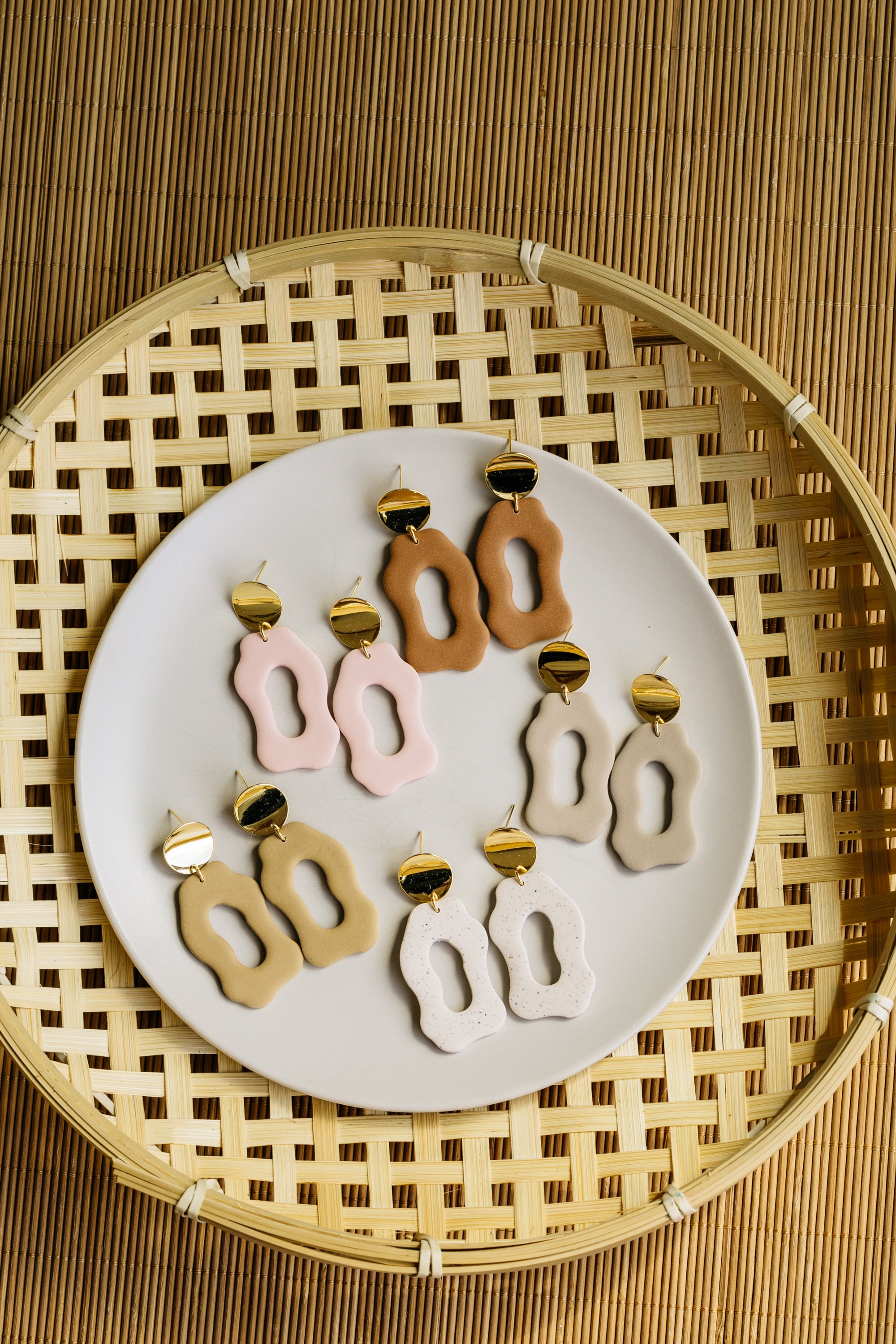 golden earrings with acrylic in white, petrol and brown