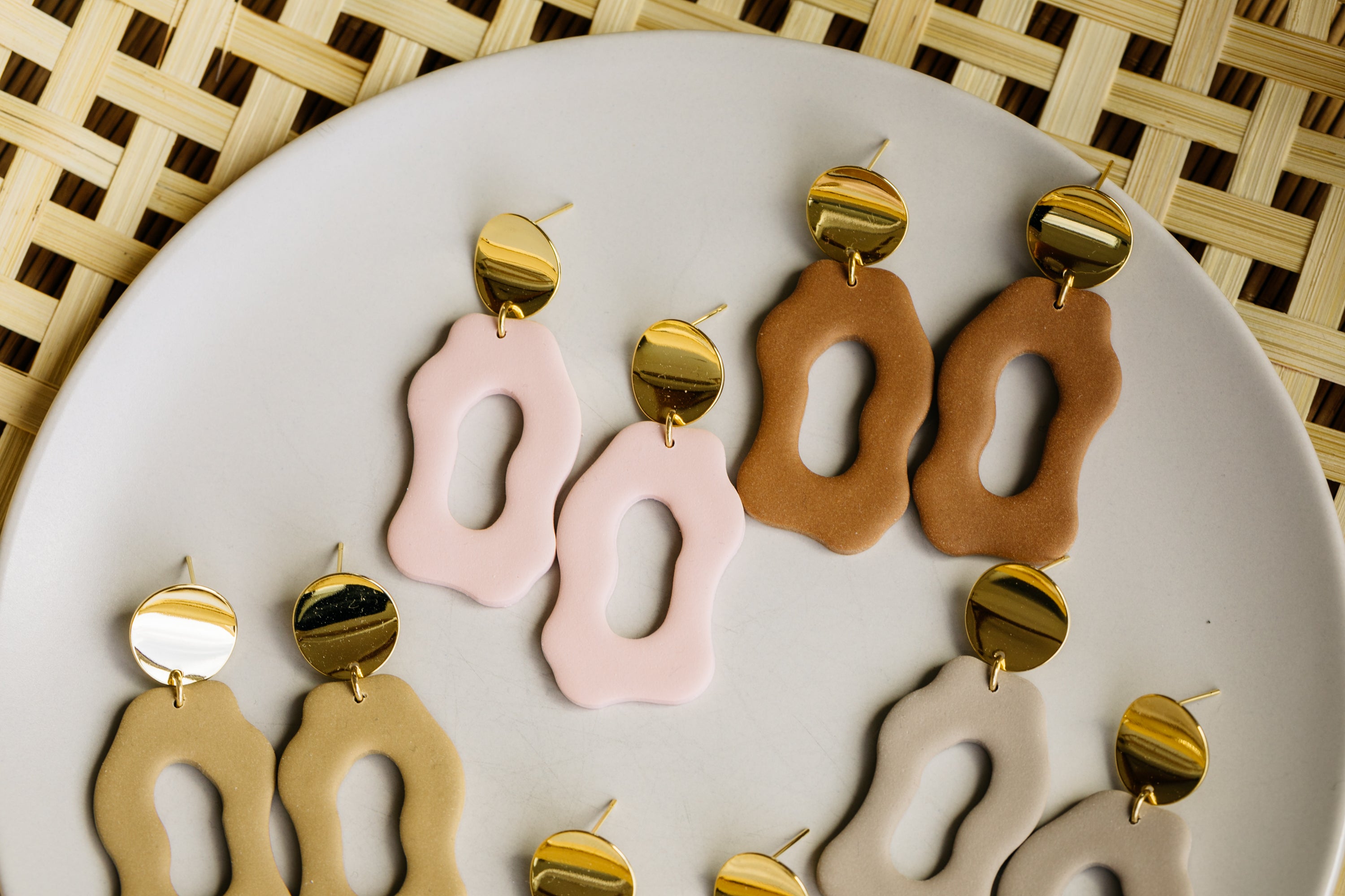 golden earrings with acrylic in white, petrol and brown