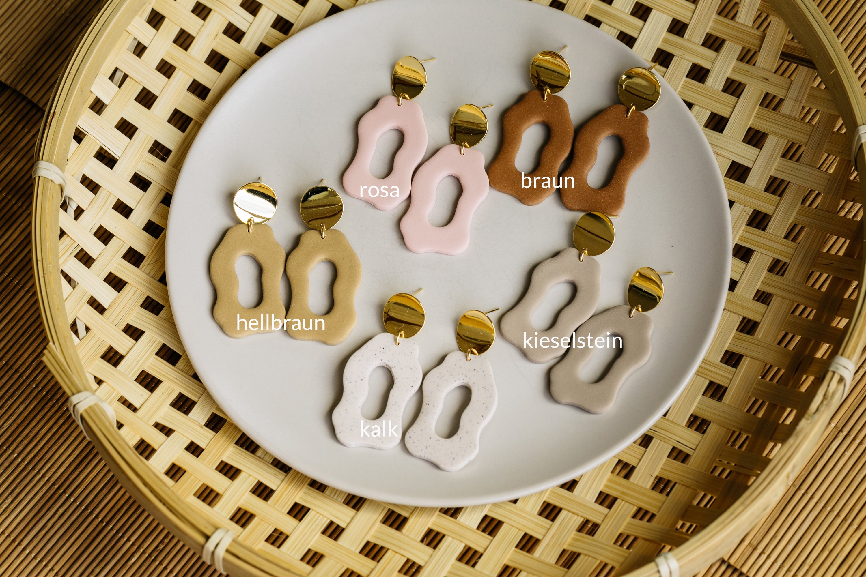 golden earrings with acrylic in white, petrol and brown