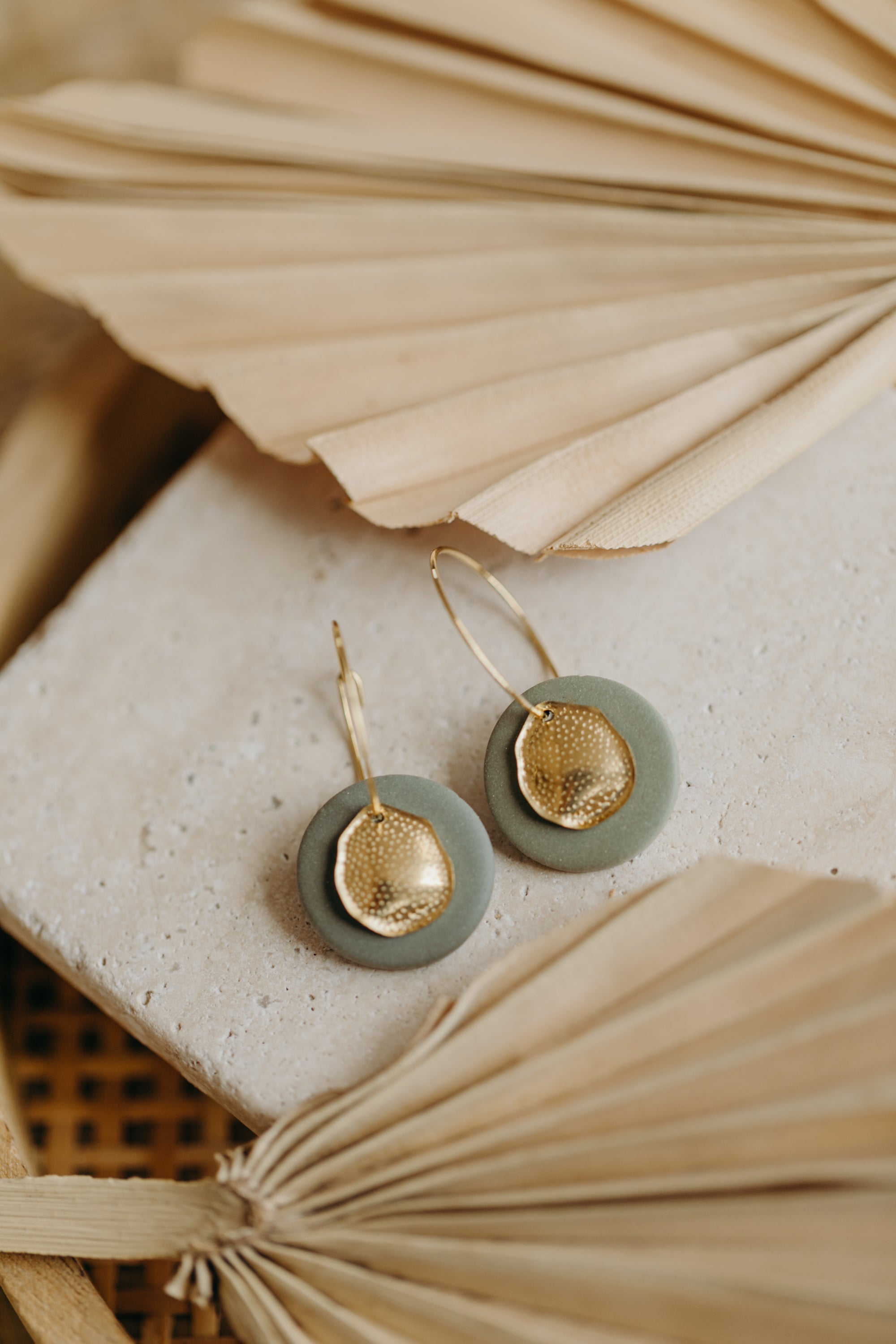 Hoop earrings with round polymer clay pendant and leaf