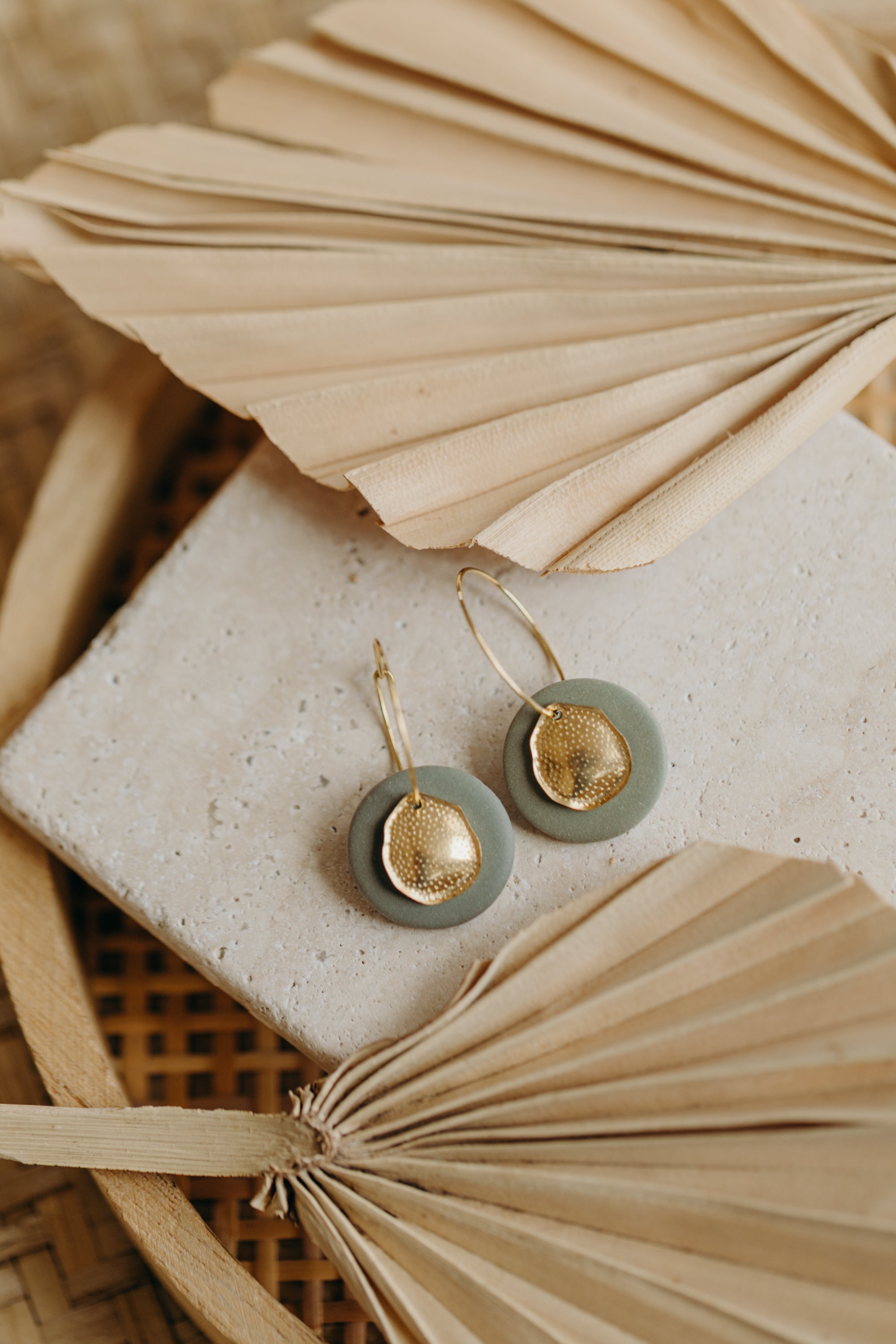 Hoop earrings with round polymer clay pendant and leaf